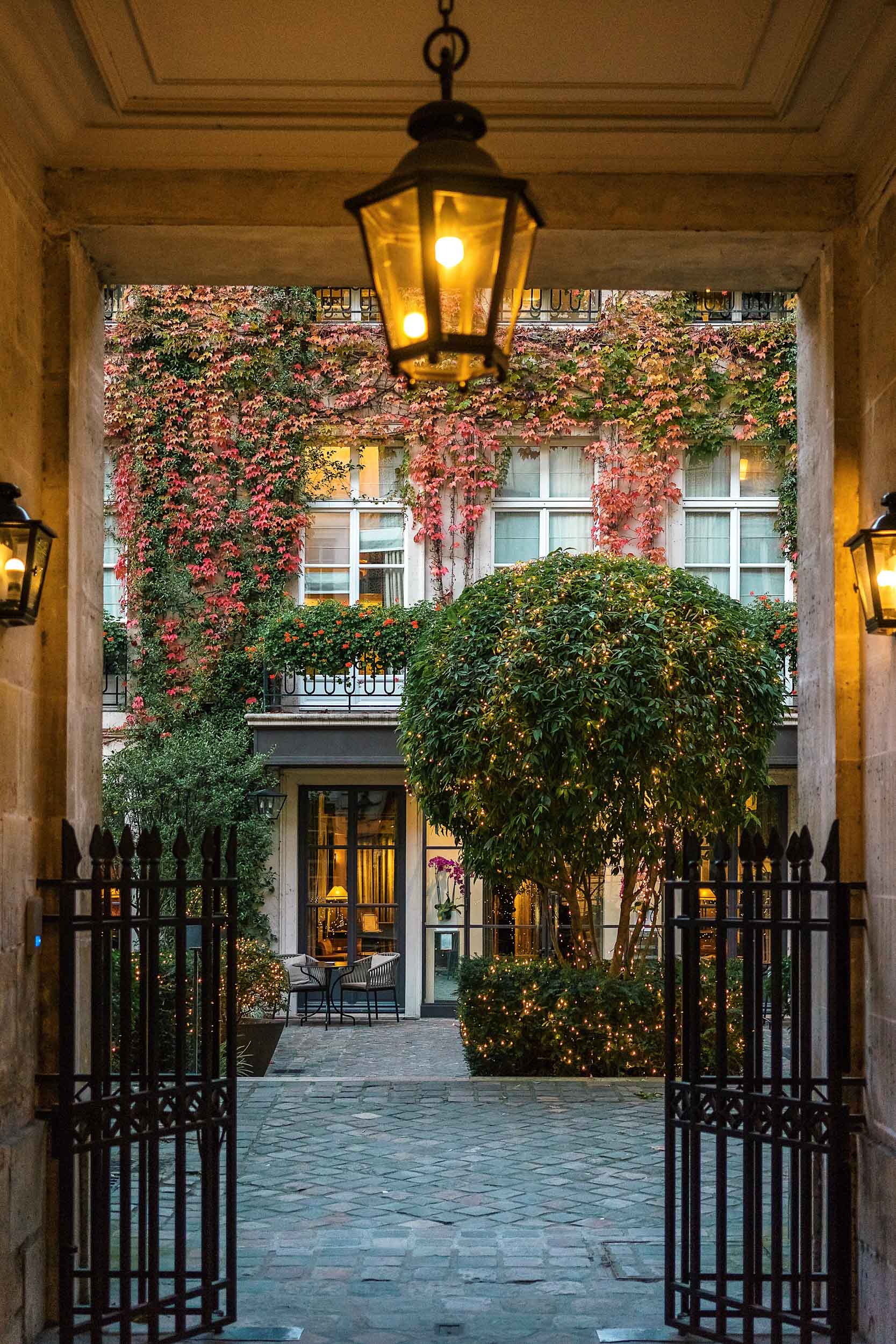 Access to Pavillon de la Reine is via a private garden courtyard set back from Place des Vosges, making it feel like your own private hideaway