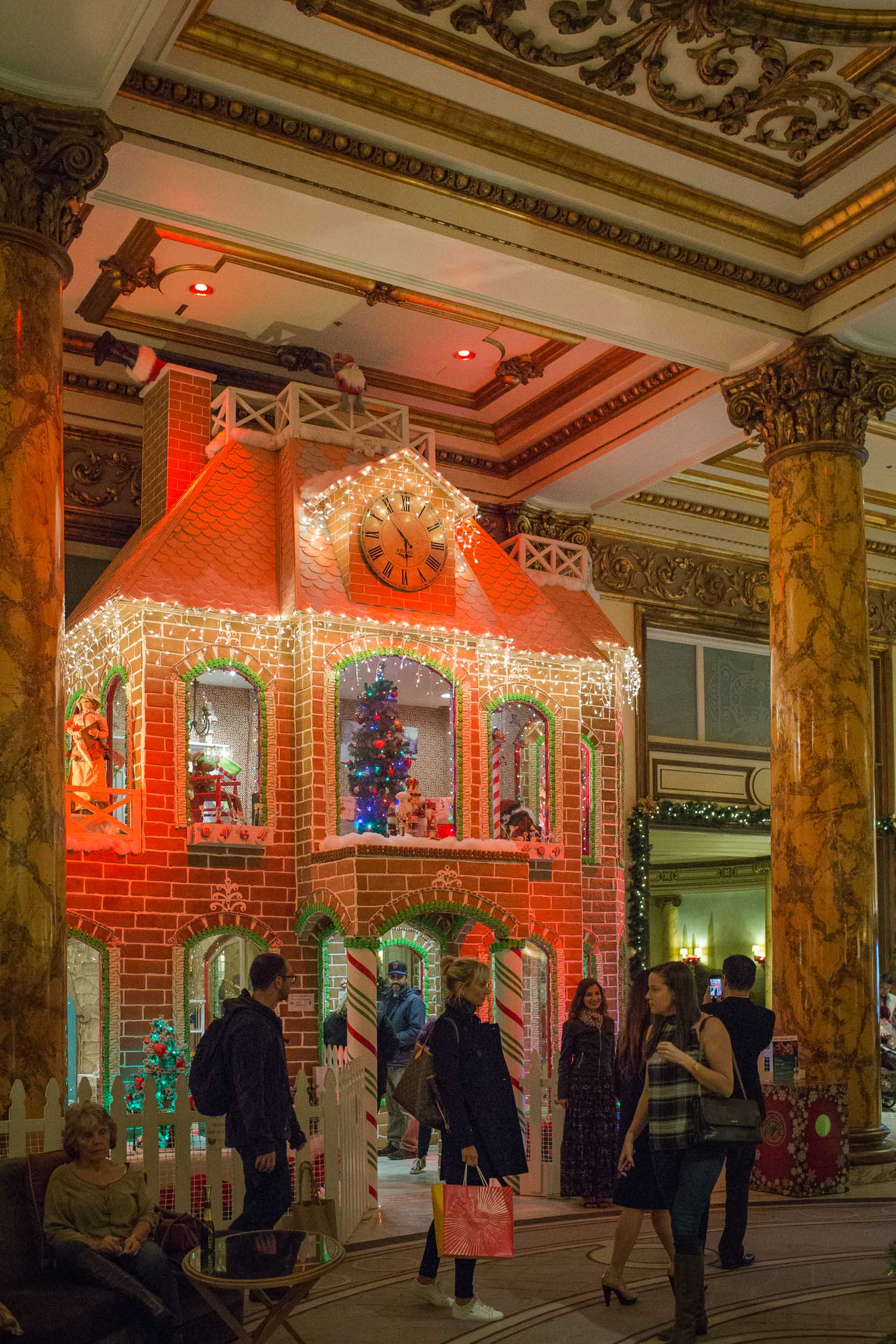The lobby of The Fairmont San Francisco at Christmas time features a 23-foot tree and a real, two-story Gingerbread House!
