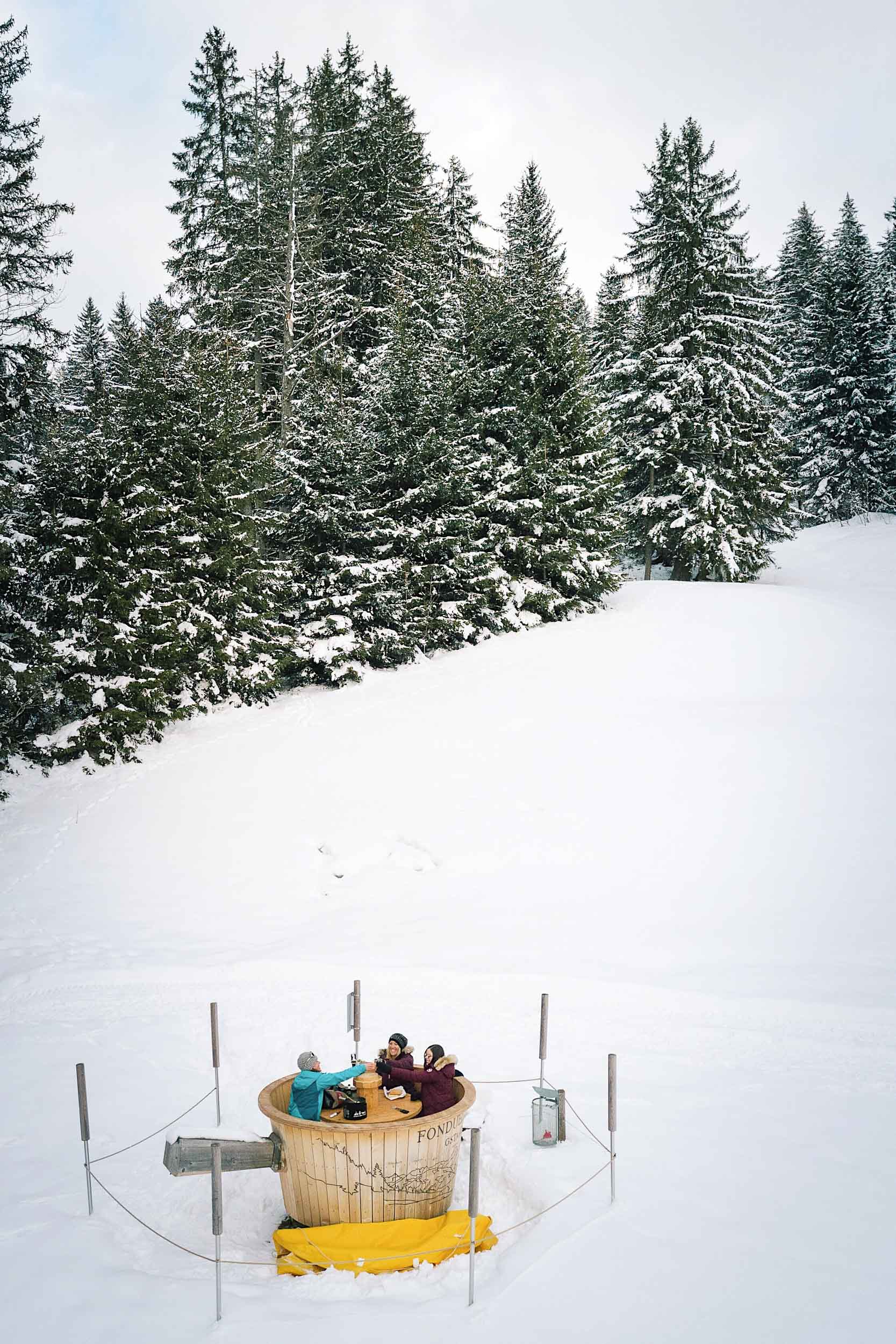 Making fondue in the middle of the Alps after a hike in Fondueland Gstaad Switzerland