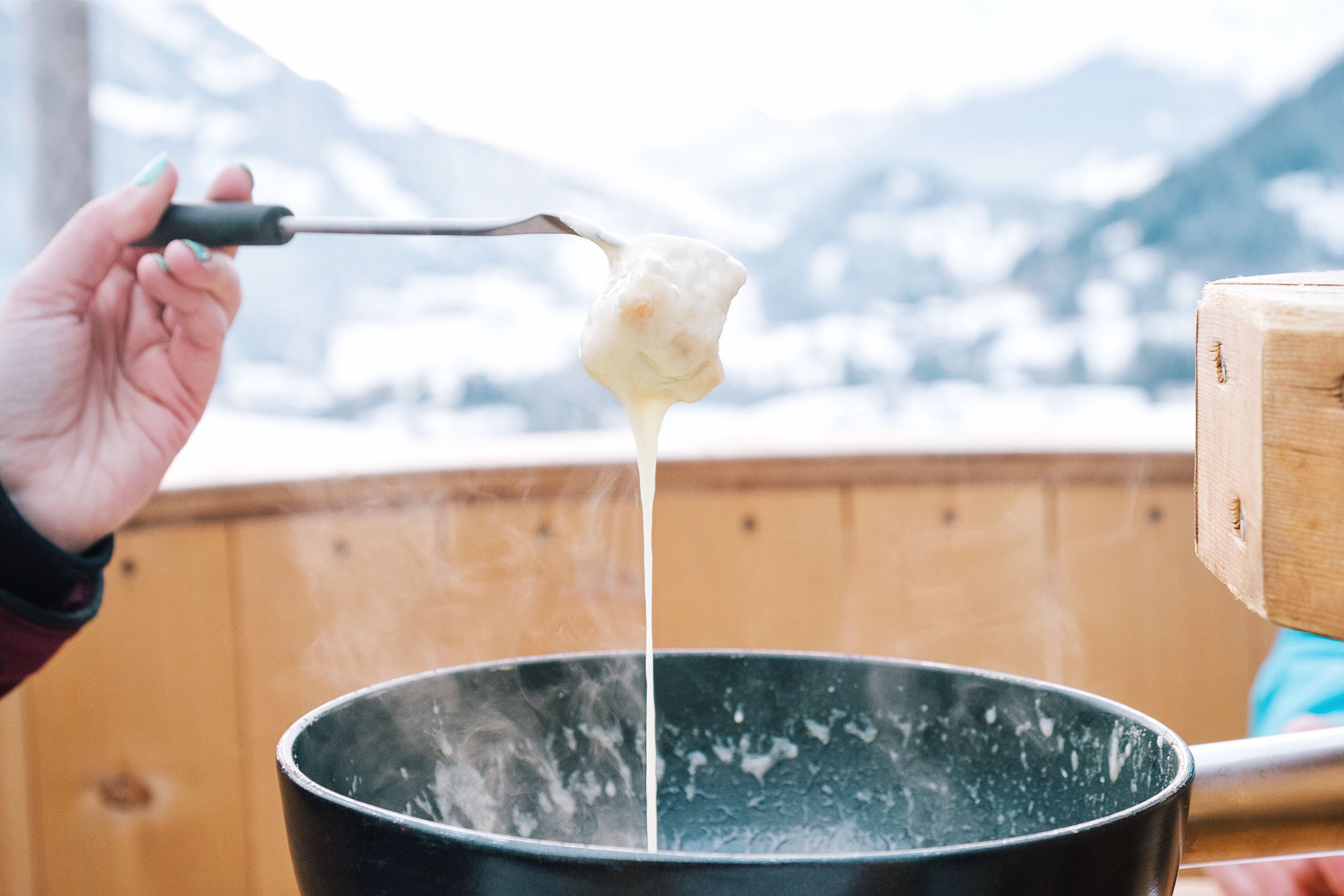 Cheesy fondue in Gstaad in the canton of Bern