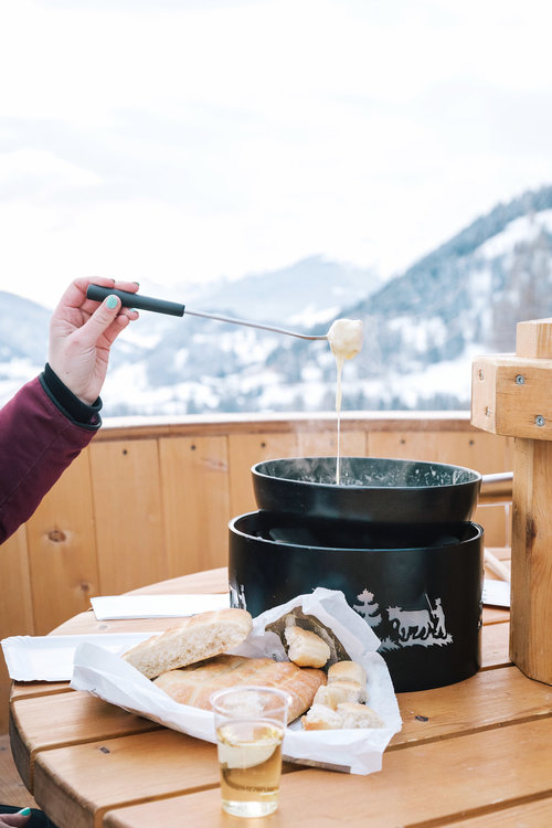 Making fondue in the middle of the Swiss Alps