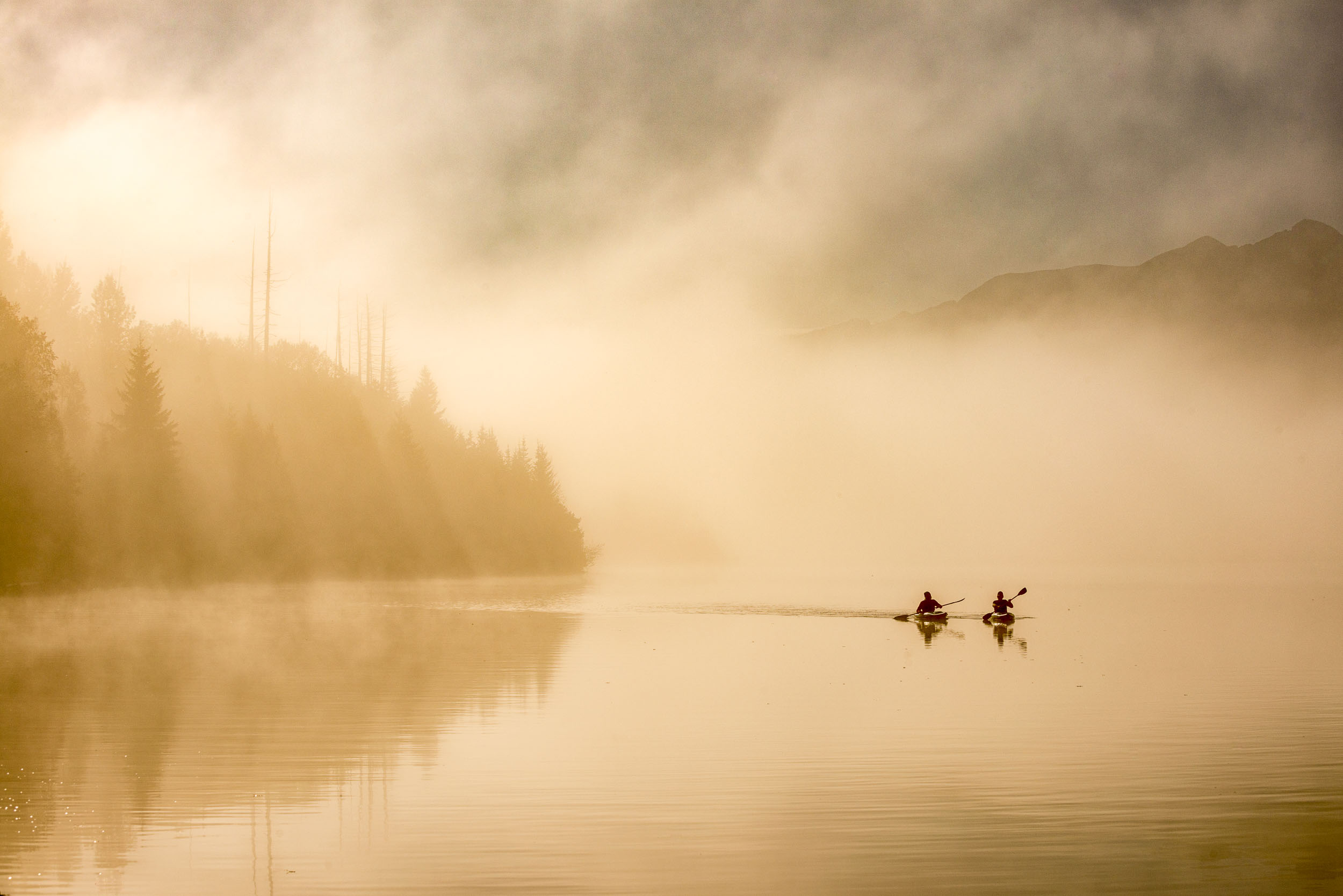Kayaking on Crooked Lake. Credit: Destination BC/Michael Bednar