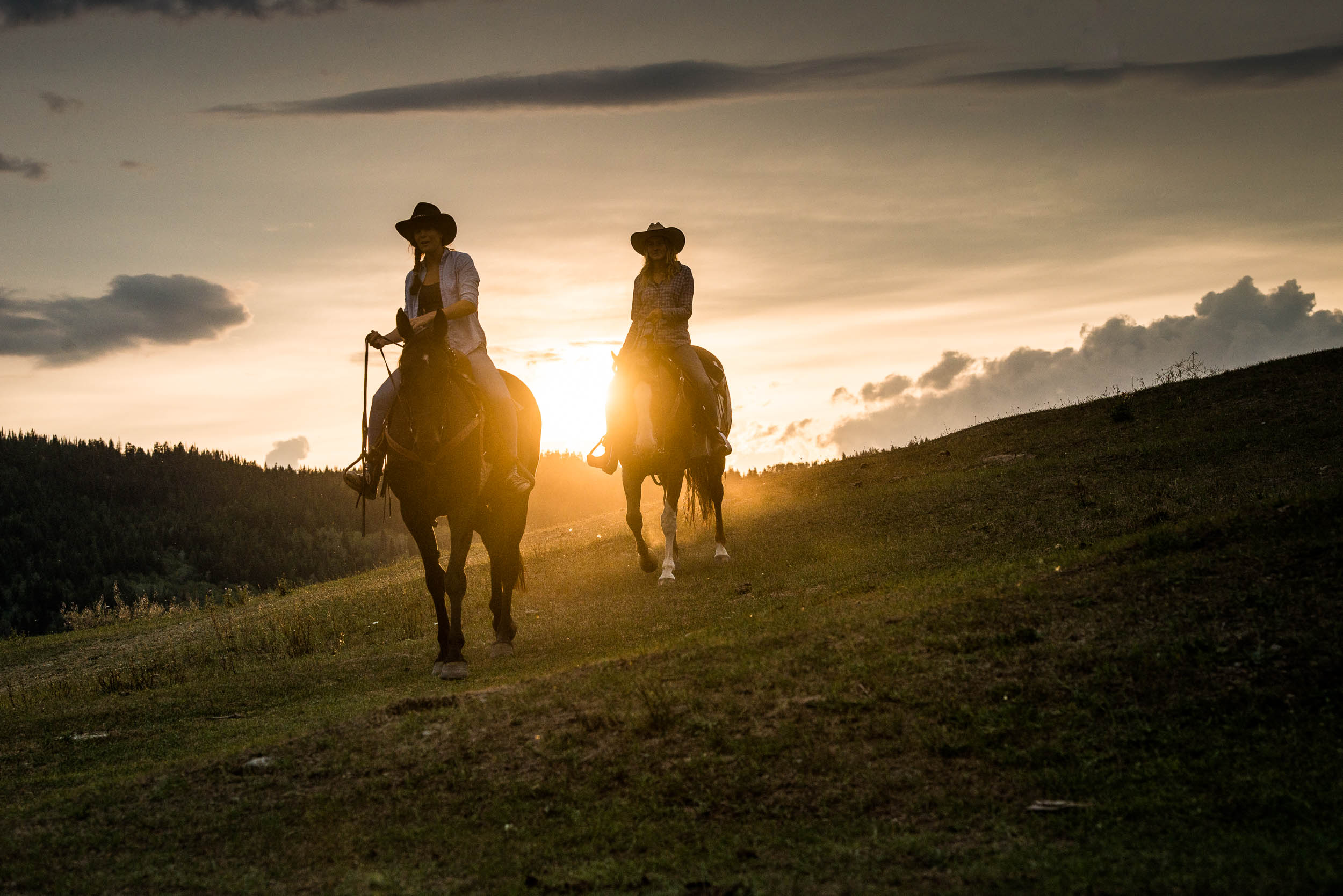 Sunset horseback riding at Kayanara Guest Ranch & Resort in Eagle Creek. Credit: Destination BC/Blake Jorgenson