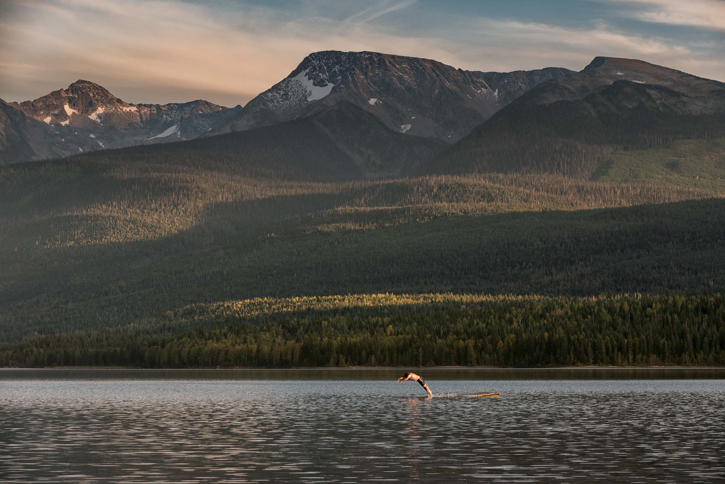 Swimming in Crooked Lake in the Cariboo Mountain range. Credit: Destination BC/Michael Bednar