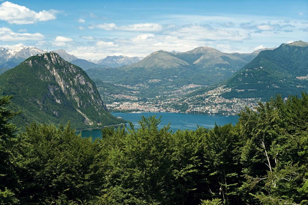 UNESCO World Heritage Monte San Giorgio in Ticino. View from Monte San Giorgio towards Lugano, Monte San Salvatore on the left, Monte Bre on the right. 