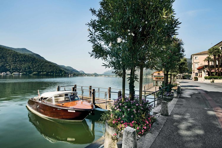 Morning mood with boat at the Lake Lugano, Morcote. Copyright by: Switzerland Tourism