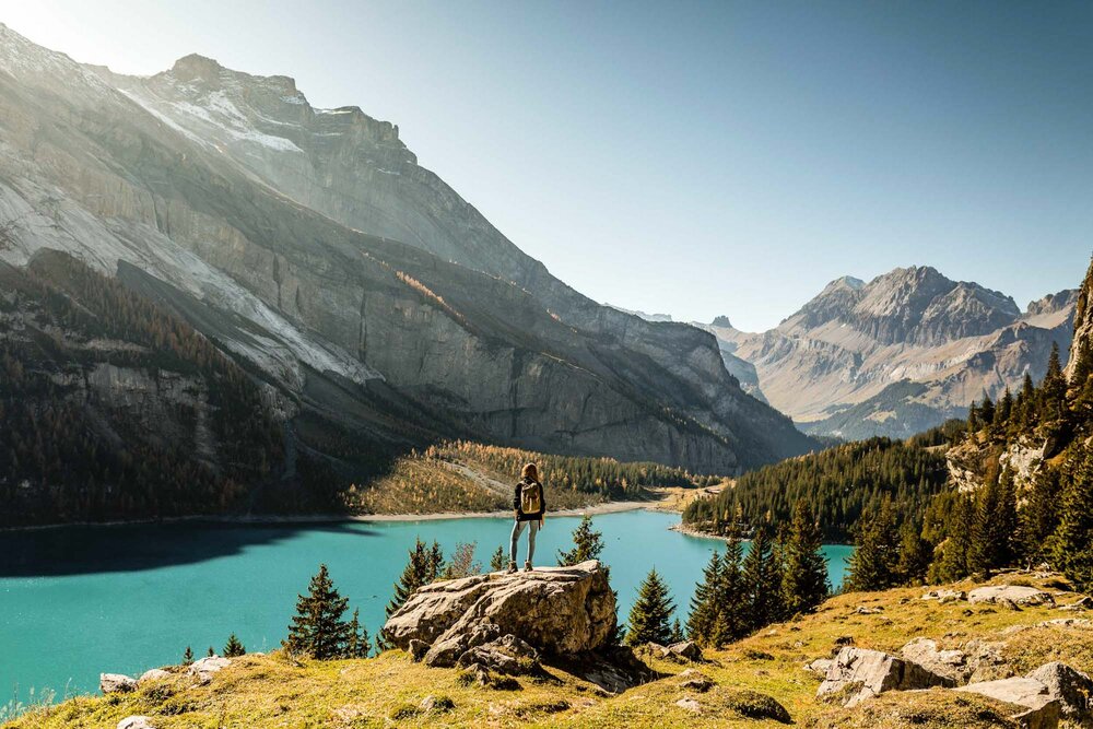 Autumn mood with a hiker at Oeschinensee near Kandersteg. Copyright by: Switzerland Tourism