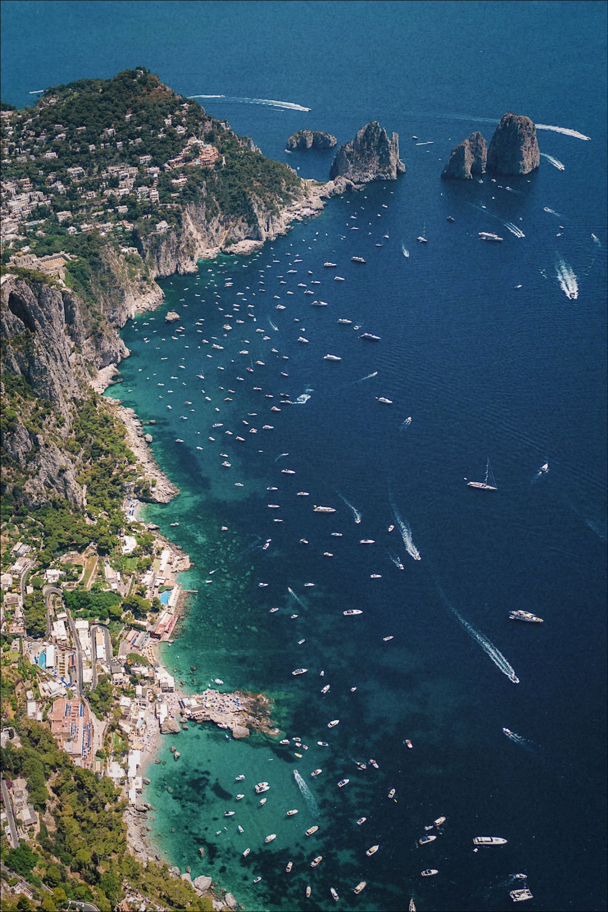 Beautiful views of some of the beaches in Capri in Marina Piccola with views of the Faraglioni