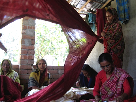 Bengal women creating scarves and blankets for Amba Gallery