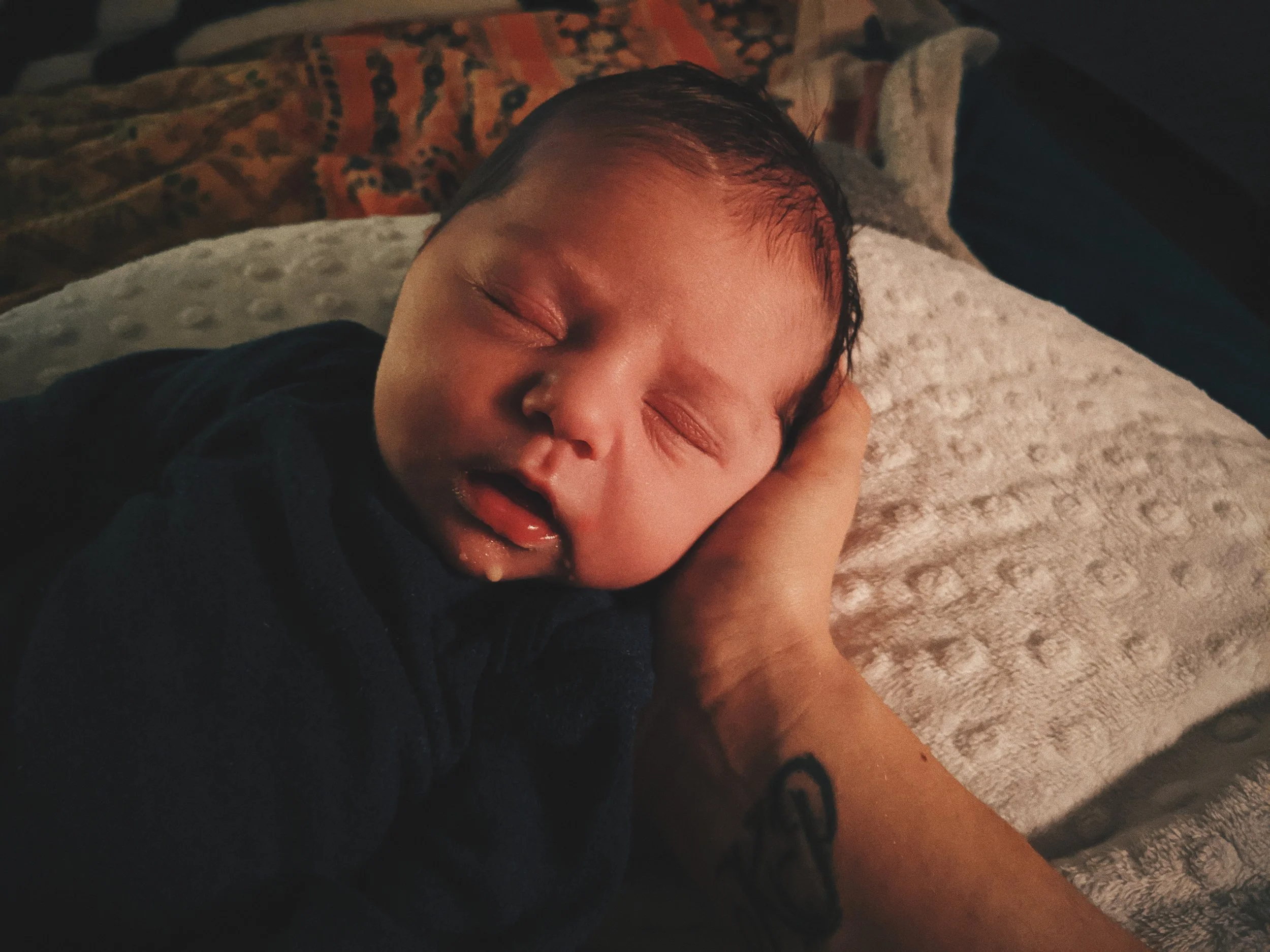breastfed baby with milk