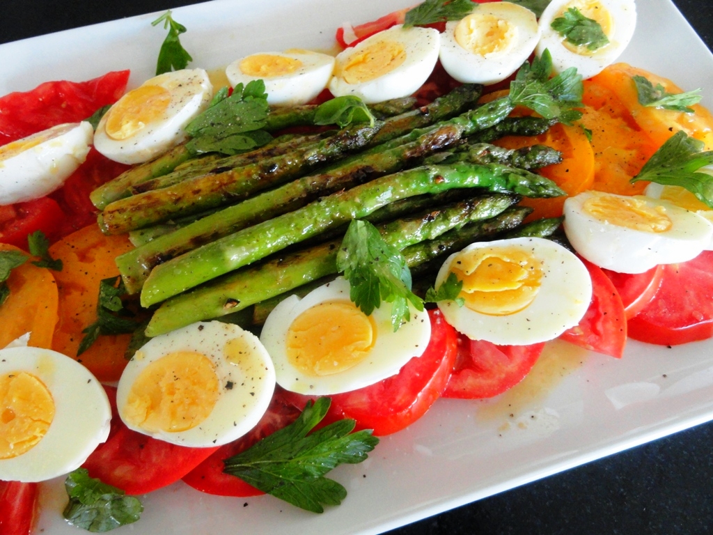 Red and golden heirloom tomato, grilled asparagus, and hardboiled egg with parsley and red wine vinaigrette