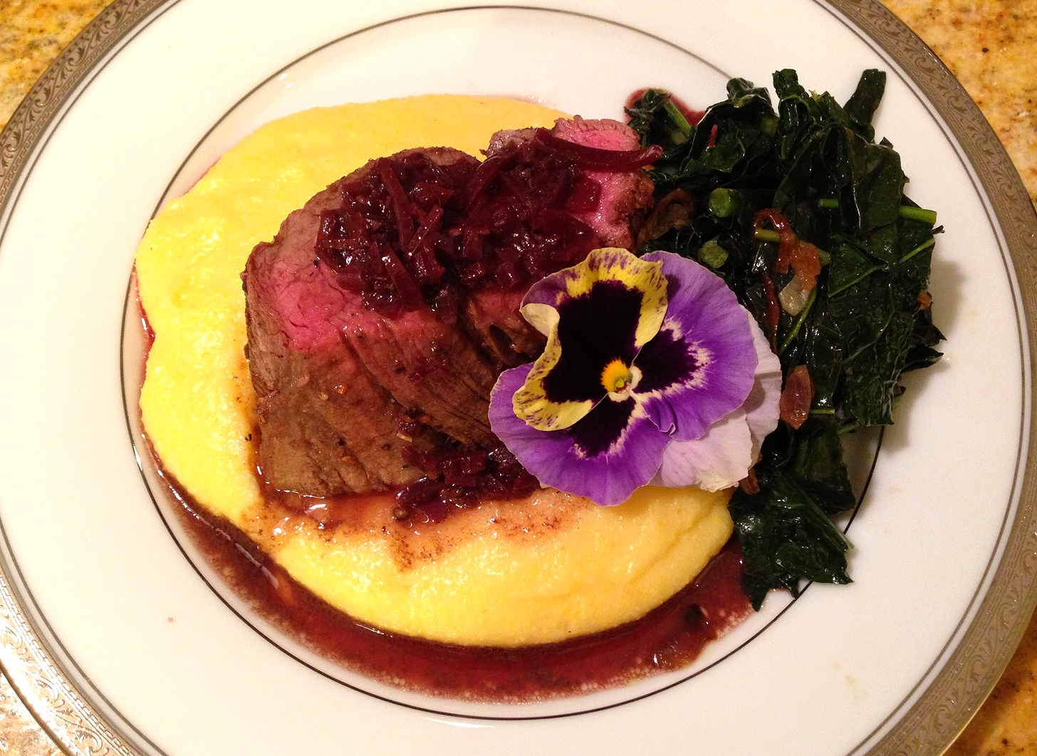 Pepper-crusted beef tenderloin on soft polenta, Tuscan kale with garlic and peperoncino, and a barolo sauce