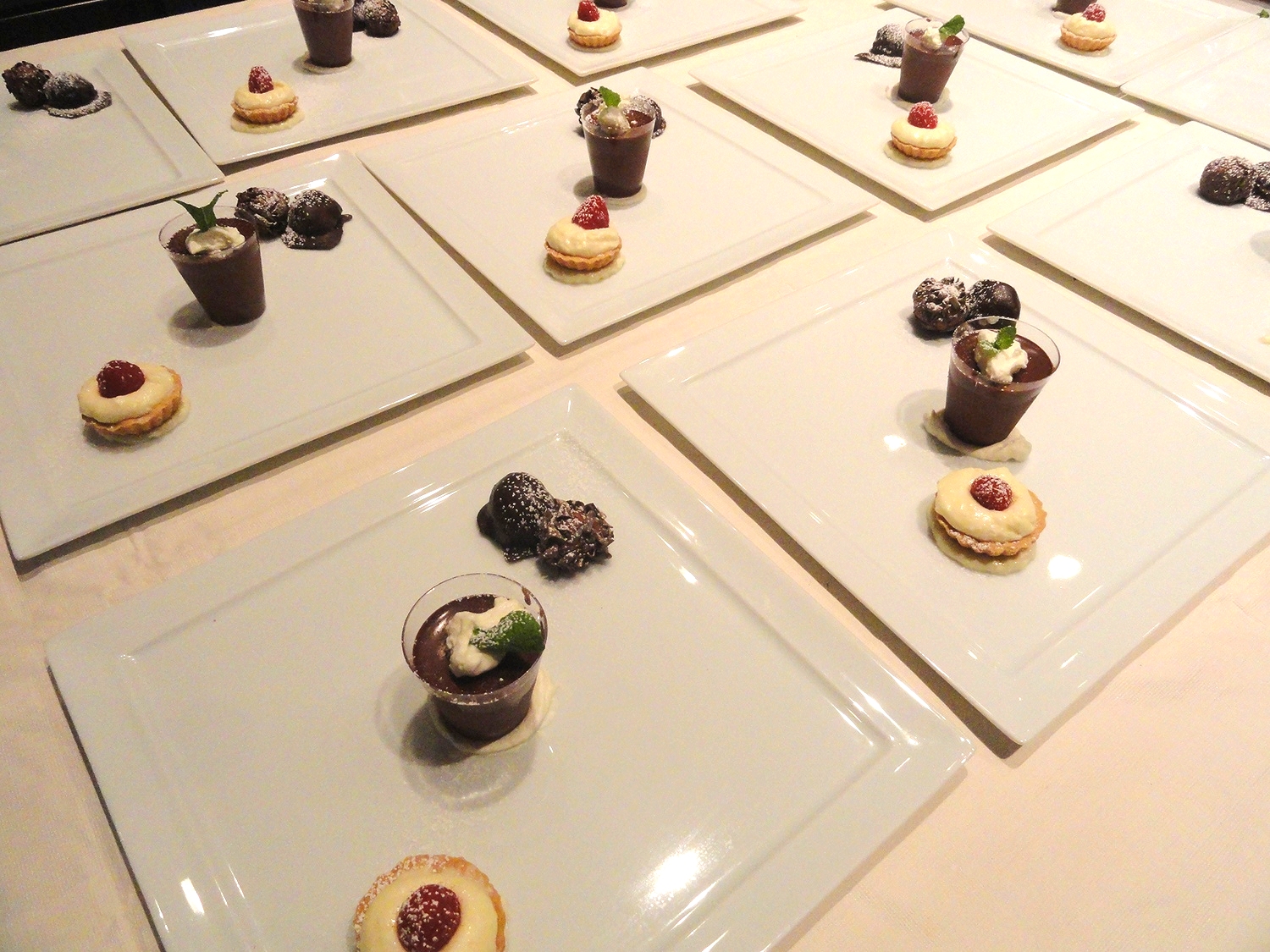 Chocolate trio: Chocolate pot de creme with minted cream, white chocolate mousse tartlet, chocolate champagne truffles