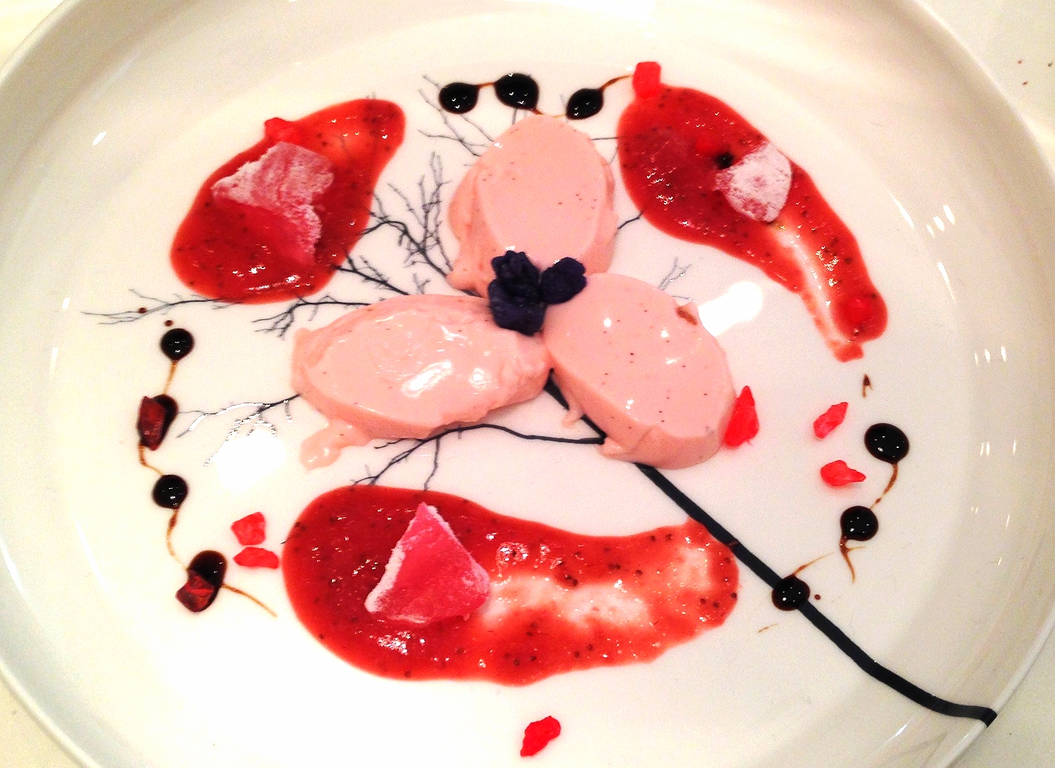 Rosewater panna cotta, strawberry sauce, turkish delight, candied violets and balsamic swirls