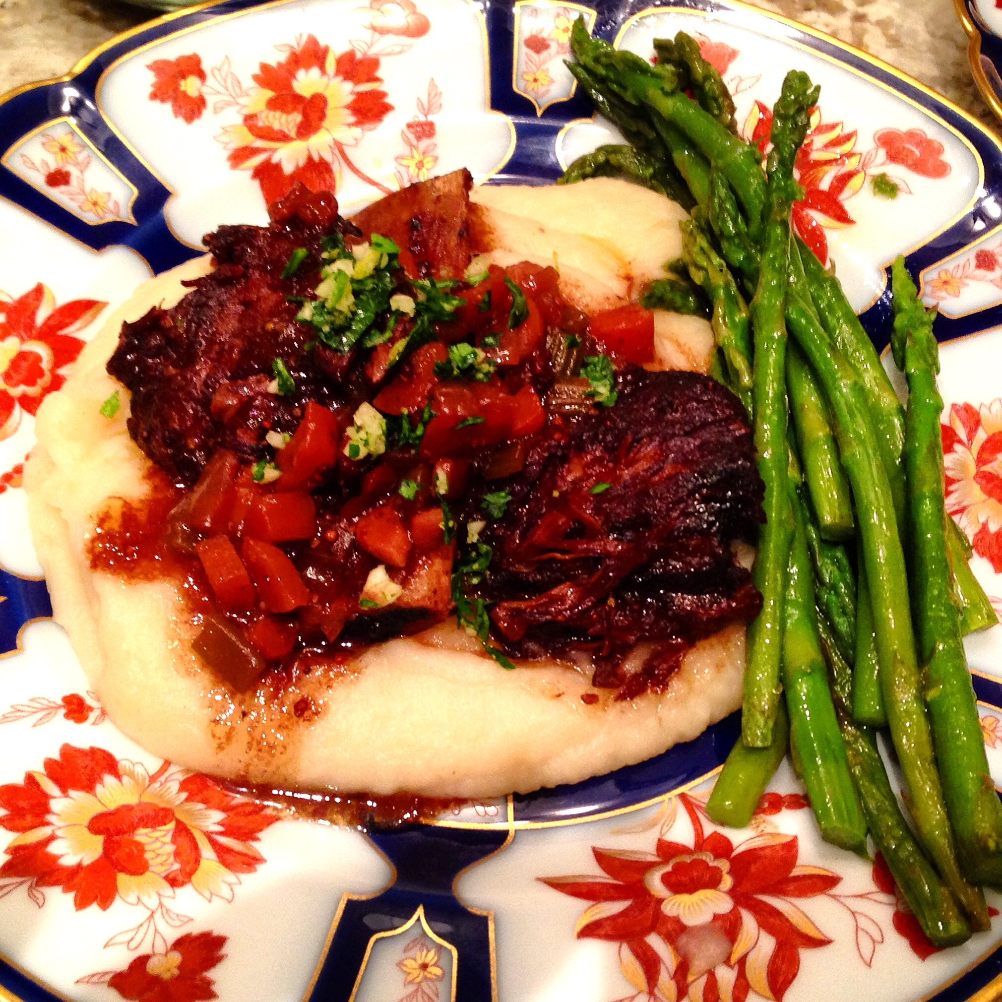 Slow-braised Korean style beef short ribs with soy-ginger-sherry sauce and vegetables, on celeriac puree, asparagus