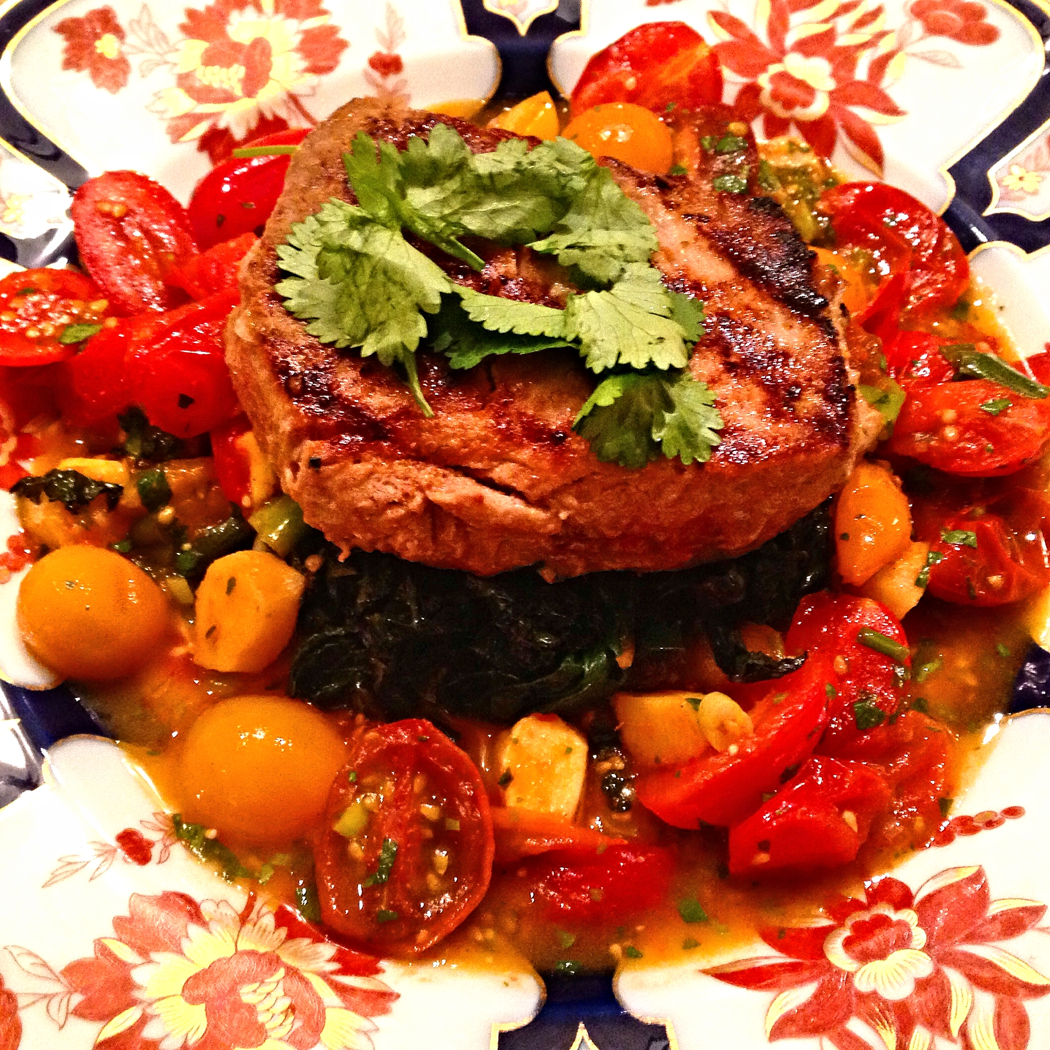Tuna steak on Indian-spiced chard and warm tomato-ginger-cilantro sauce