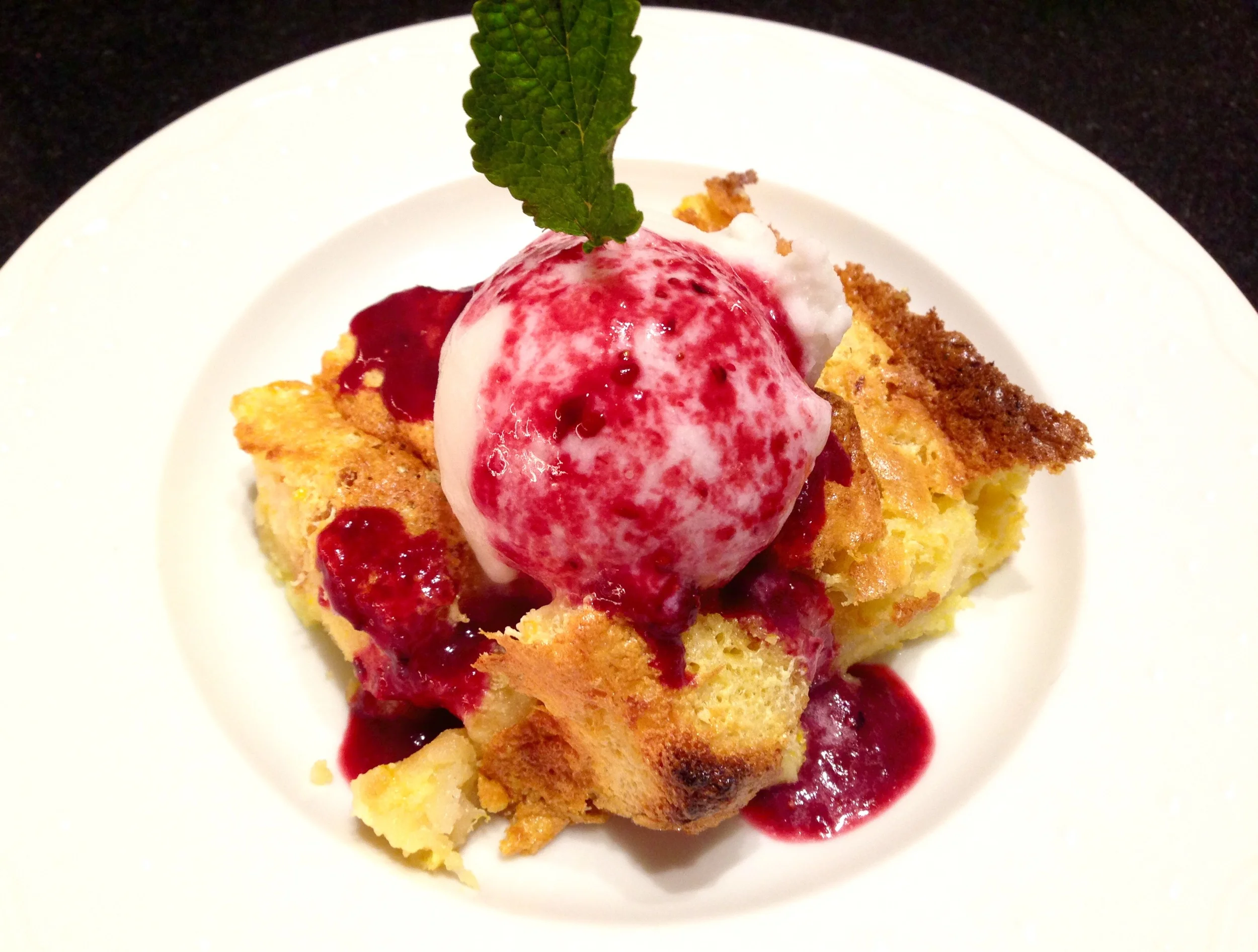 Meyer lemon bread pudding, coconut sorbet, warm mixed berry sauce