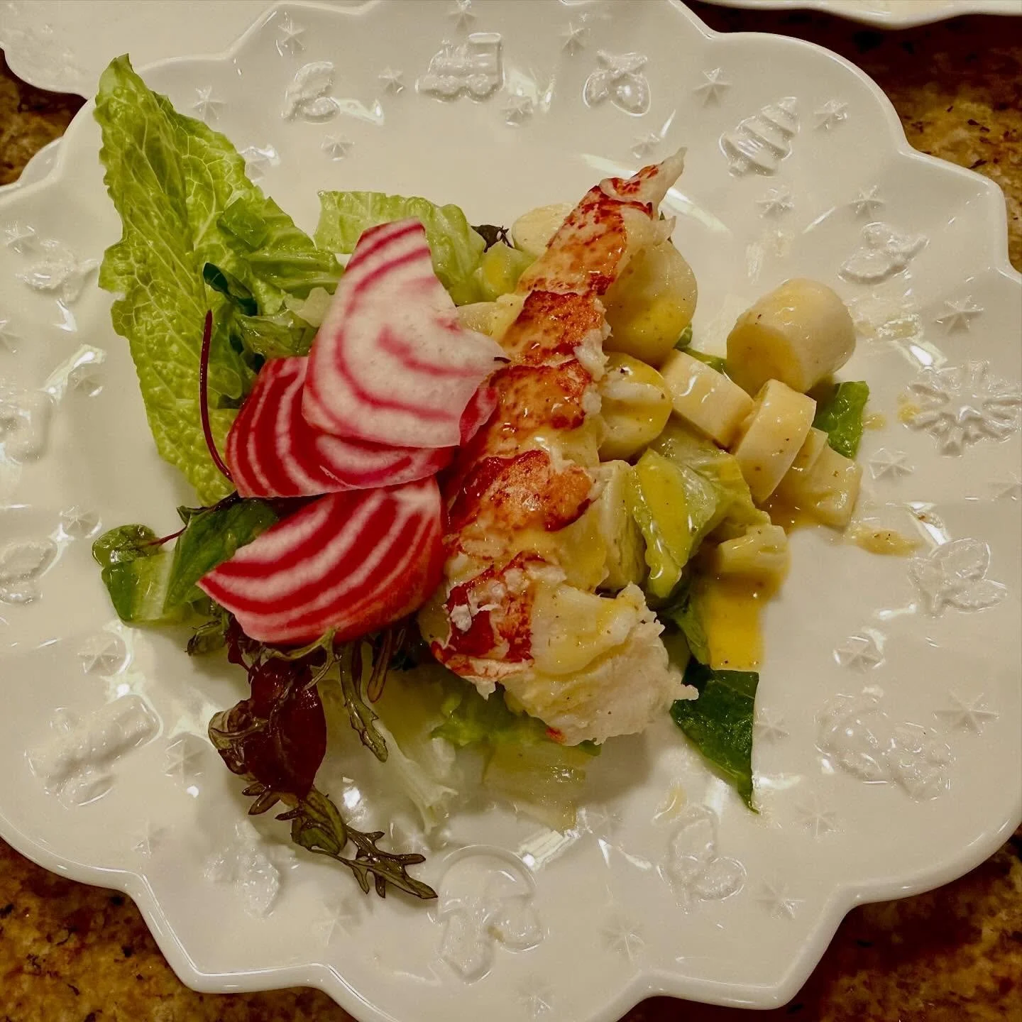 Lobster tail over hearts of palm and romaine salad, chioggia beets, passion fruit-citrus vinaigrette. #bluaubergine #fabulousfood #catering #privatechef #christmasdinner #holidaymeals #lobster