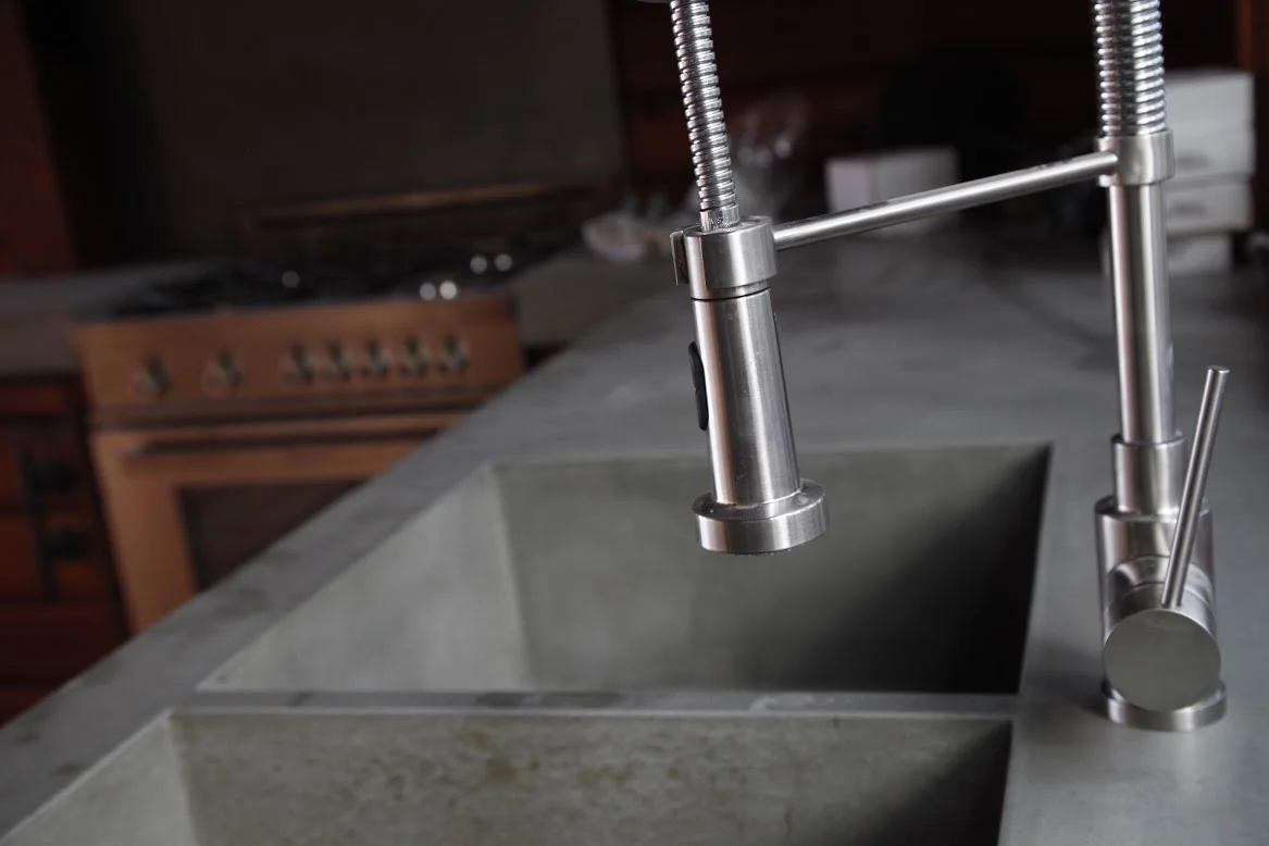 One of our kitchen renovations with gorgeous polished concrete sink and modern fixtures