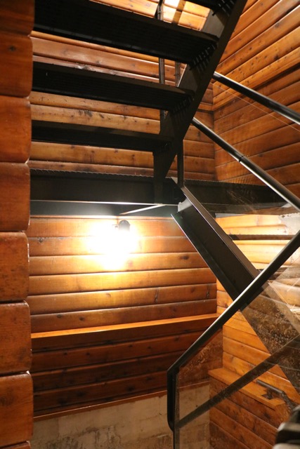 Glass, metal and wood stairwell custom made by us