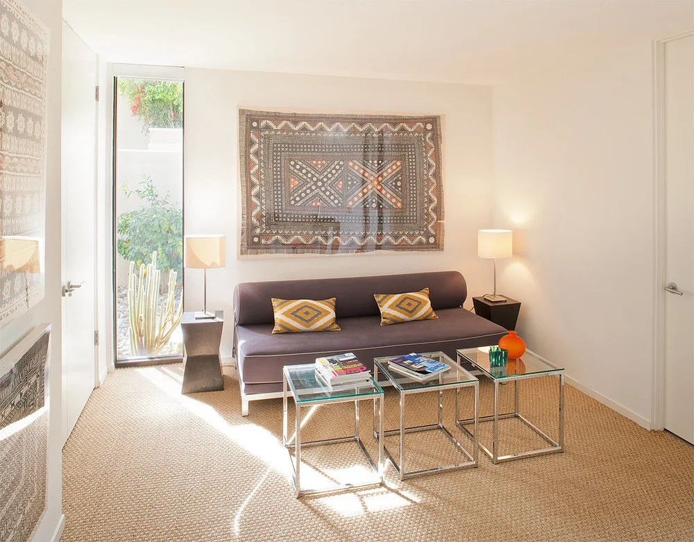 22c5a-framed-fabric-hung-above-sofa-provides-unexpected-twist.jpg