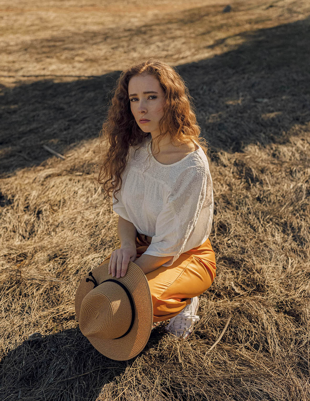 girl-sitting-in-field.jpg