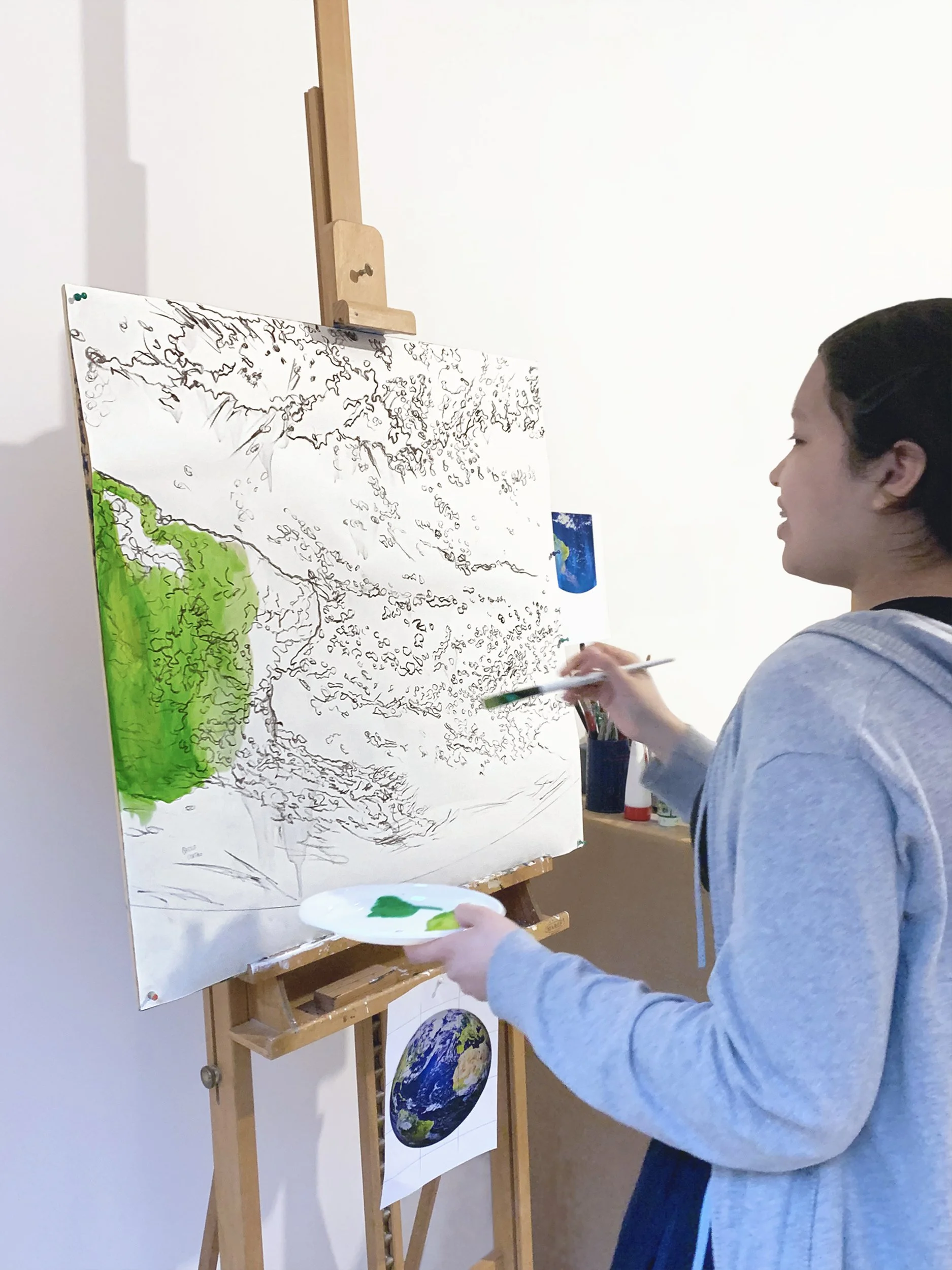 We Earth: 1 assistant painting 1 module in the art studio