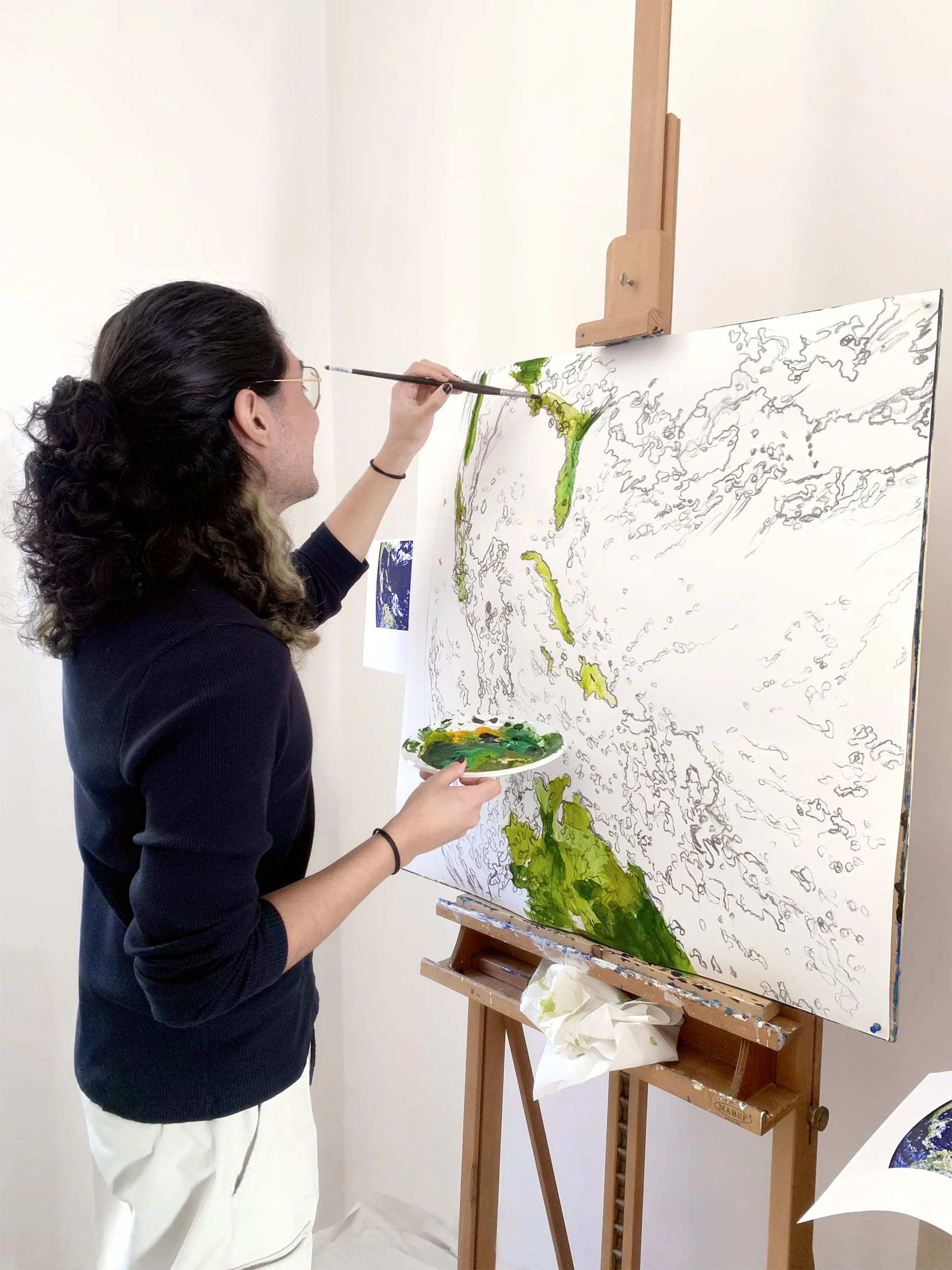 We Earth: 1 assistant painting 1 module in the art studio