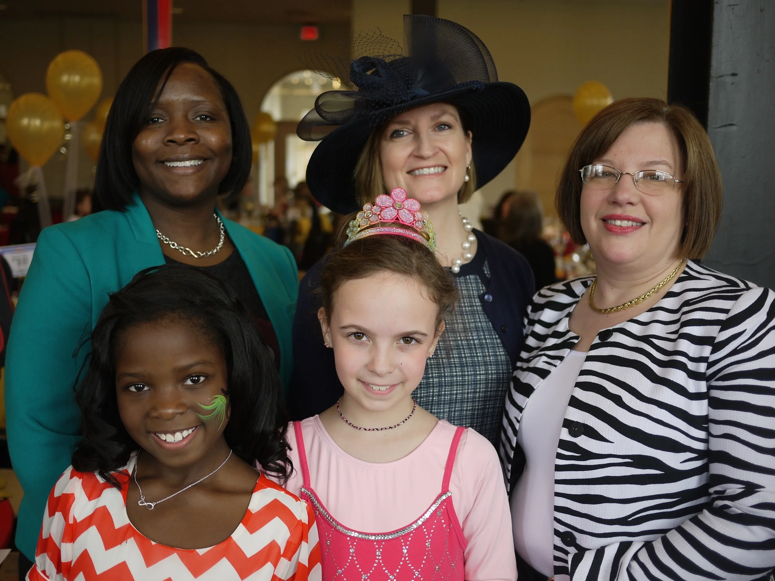 FPF President and Executive Director Lesley Hoffarth (center), with 2014 Wonderland Tea Party Co-Chairs Shonté Moore and Makenzie Roberts ( (left) and Gen Frank and Gabby Schmiedeke.