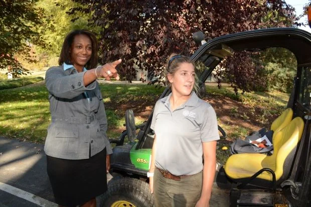 Tamara, working out in the field with Horticulturist Jaimie Tyler