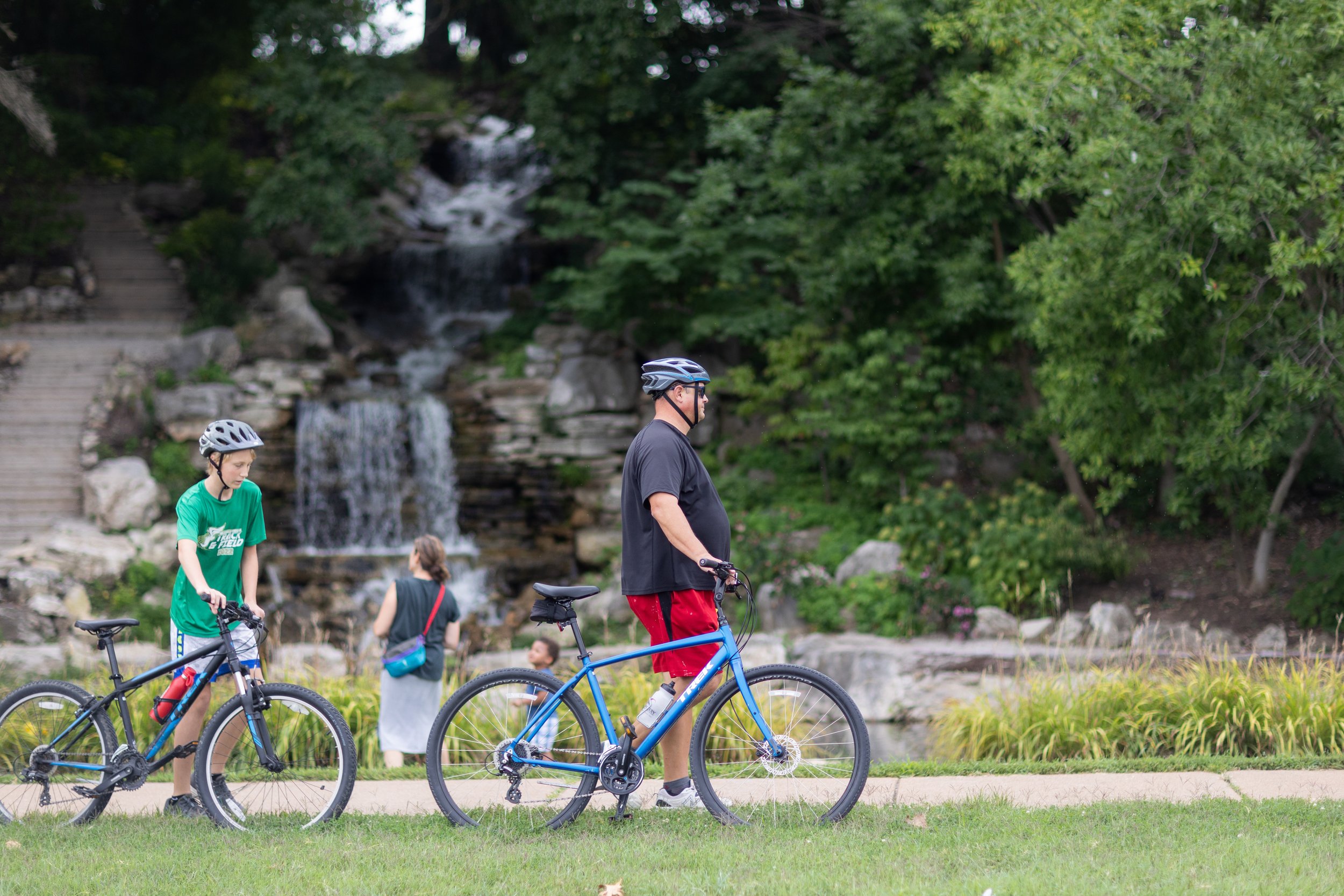  Visitors cycling near the Cascades waterfall 