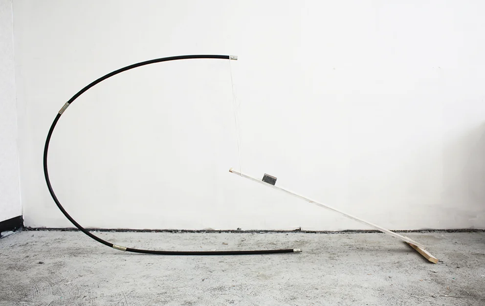"Supportive Curve 1" (2014), Robyn Benson. Plastic, Brick, and Wood