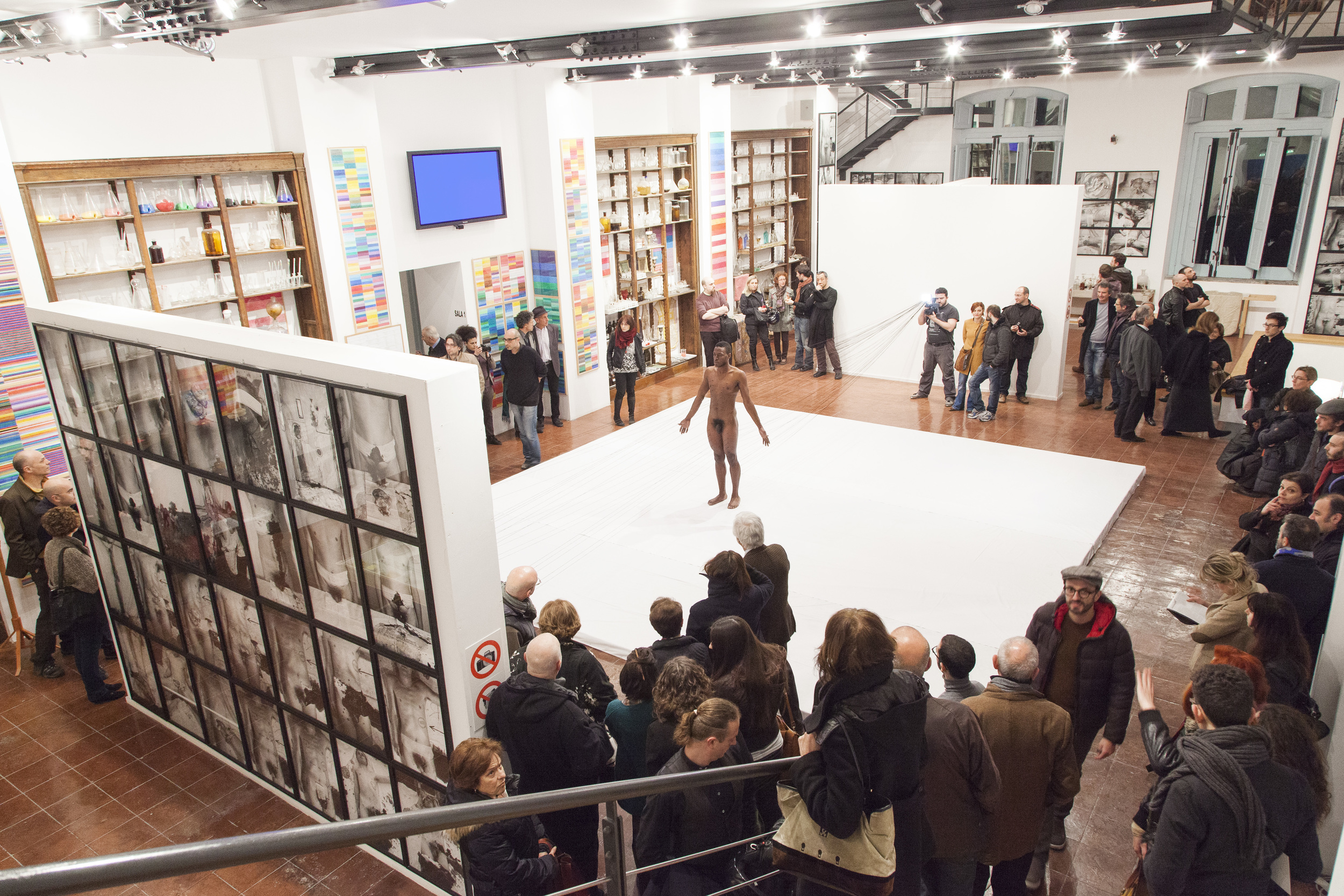 Carlos Martiel curated by Eugenio Viola performing "Punto de Fuga" at Nitsch Museum in Napoli, Italy in 2013. Photograph by Amedeo Benestante