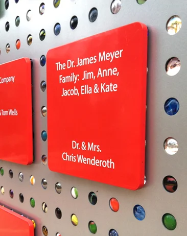 Donor names are presented on colorful shapes that can be removed for easy updating.