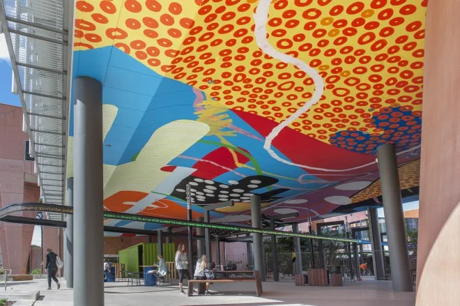 "Curtin partnered with local independent, non-profit cultural organization FORM to bring an international “who’s who” of urban artists to the campus as part of PUBLIC2016. This mural is by American artist HENSE, painted on the ceiling of a new building on campus | Image Credit: Christophe Canato " Photo: Projects for Public Spaces