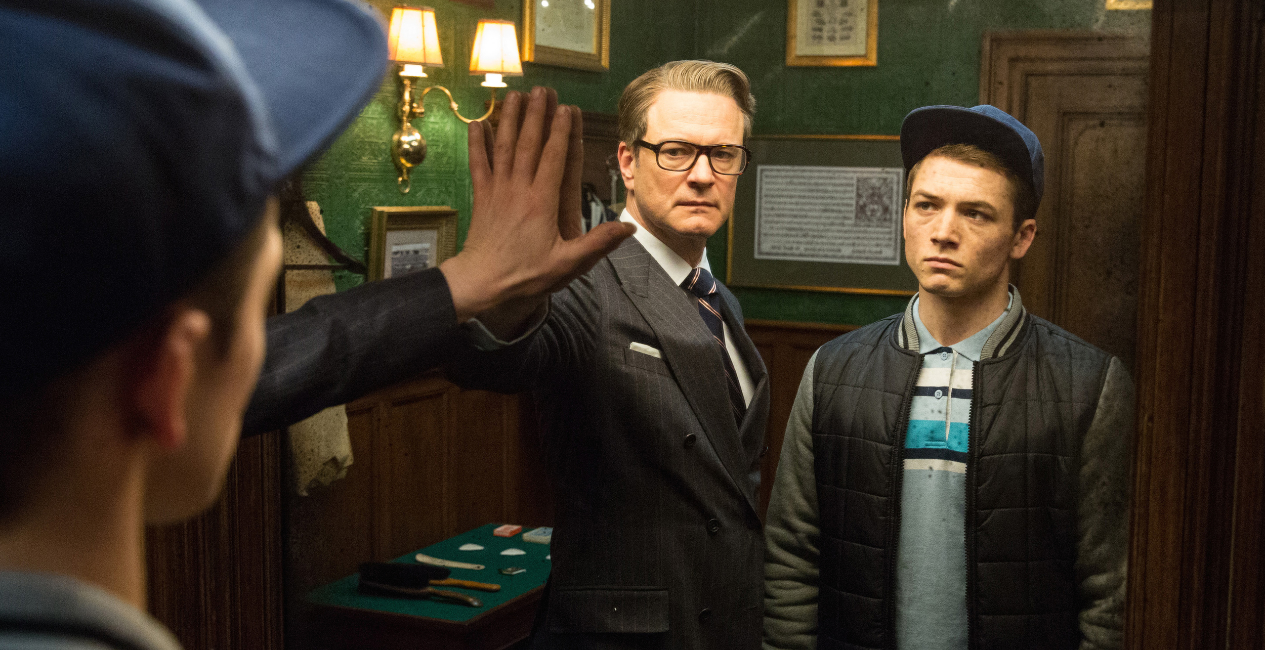 KSS_JB_D25_02636 - Harry (Colin Firth), an impeccably suave spy, helps Eggsy (Taron Egerton) turn his life around by trying out for a position with Kingsman, a top-secret independent intelligence organization.