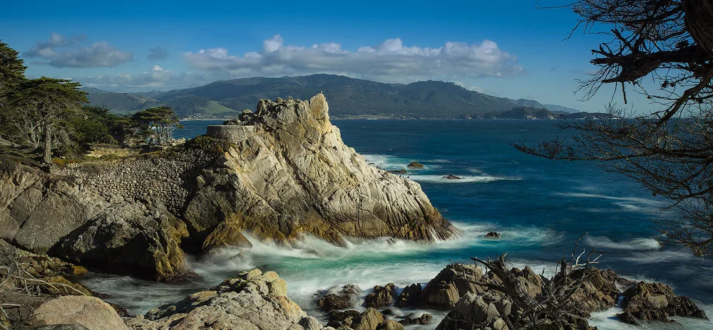Photoshop helped me not to violate the commonly enforced trademark ruling against commercially publishing a photograph of the Lone Cypress in Carmel California. 