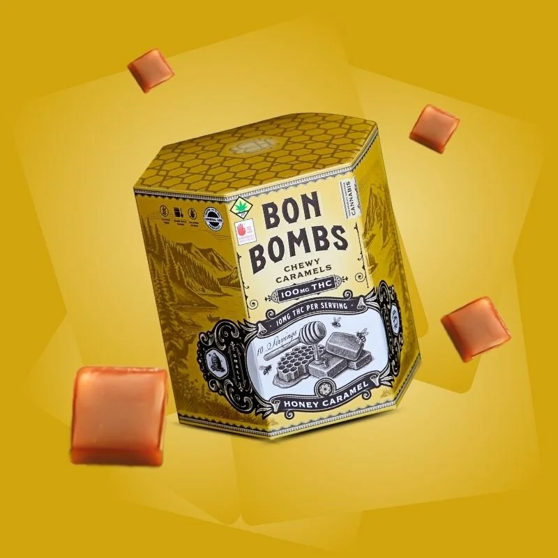 A hexagonal yellow box labeled 'Bon Bombs Chewy Caramels Honey Caramel' with caramel candies around it on a yellow background.