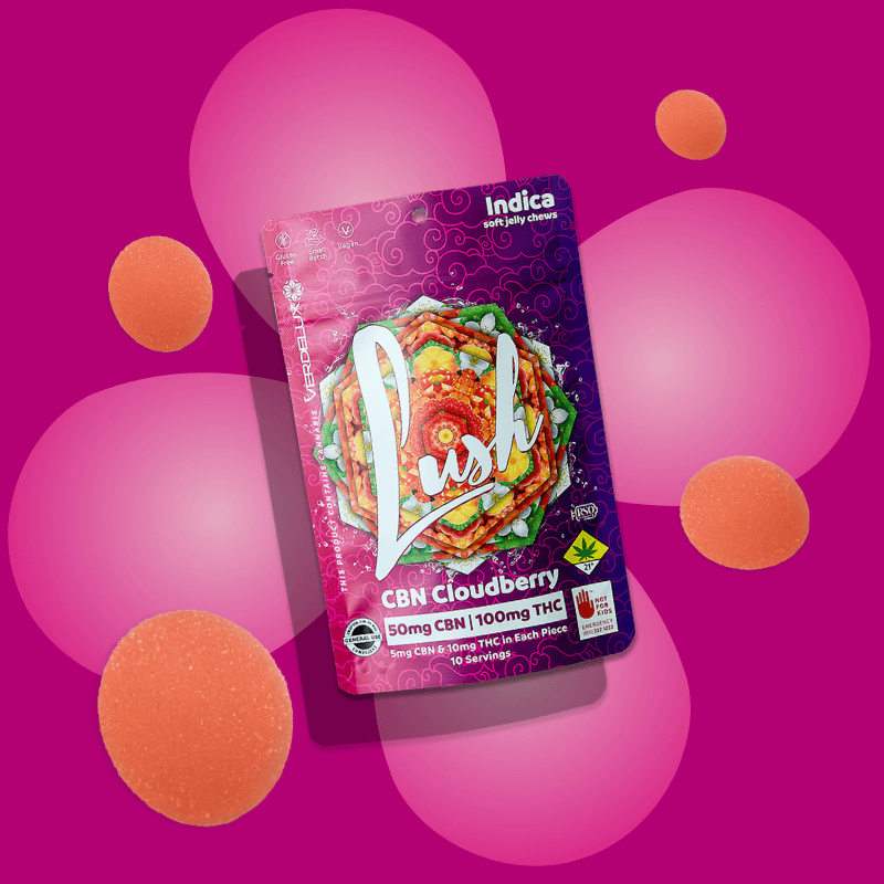 A package of Indica THC CBN Cloudberry soft jelly chews surrounded by several orange gummies on a pink and purple background.