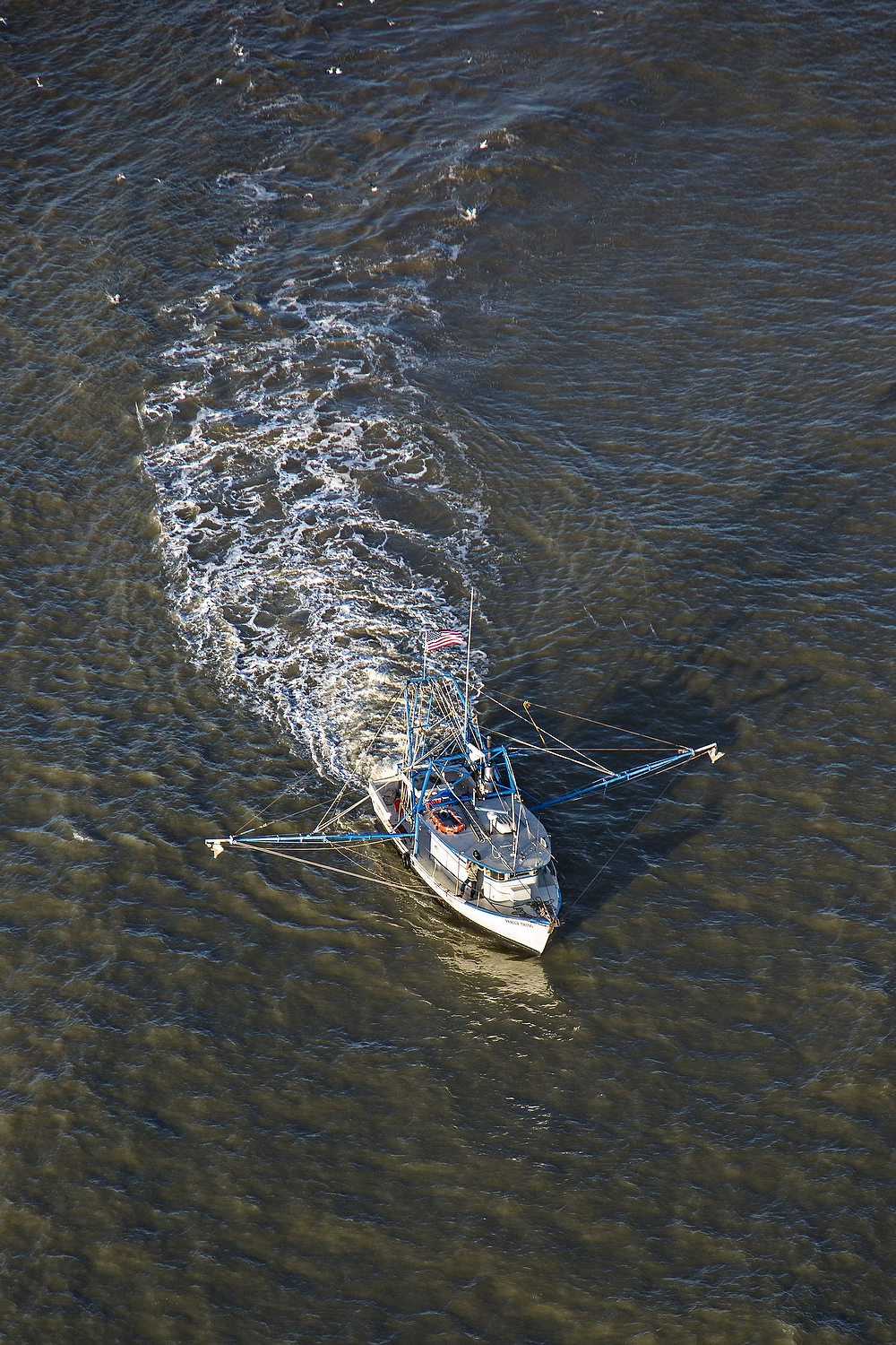  Aerial view of a shrimp boat fishing the waters off Charleston, South Carolina 