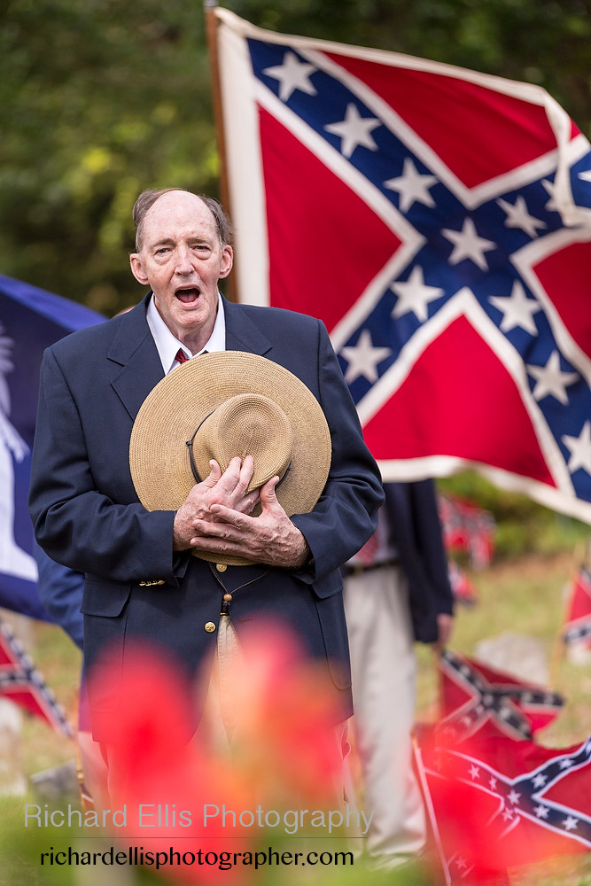 A descendant of Civil War soldiers sings "Dixie" during a ceremony marking Confederate Memorial Day at Magnolia Cemetery April 10, 2014 in Charleston, SC. Confederate Memorial Day honors the approximately 258,000 Confederate soldiers that died in the American Civil War. 
