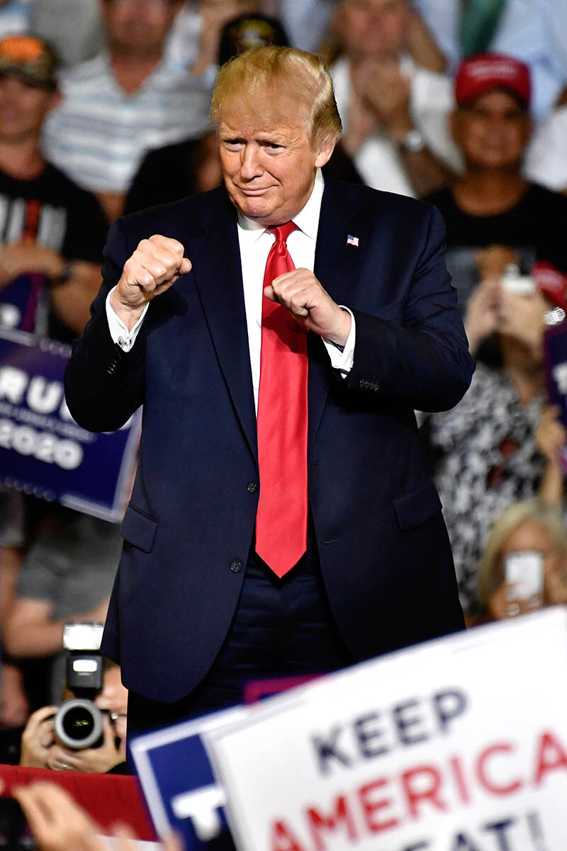  U.S. President Donald Trump greets the crowd of supporters as he arrives for a campaign rally at the Williams Arena on East Carolina University July 17, 2019 in Greenville, North Carolina.  