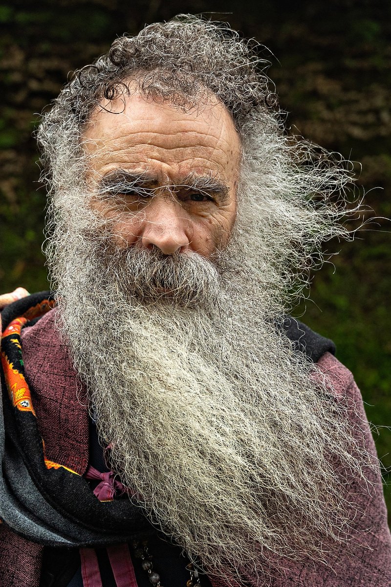  A Roman Catholic pilgrim called a Romeiro, endures blowing rain as he rest by the roadside during a 8-day trek around the Azorean Island of Sao Miguel, March 26, 2023 in Povoação, Portugal. The pilgrims visit 100 shrines and churches during the even