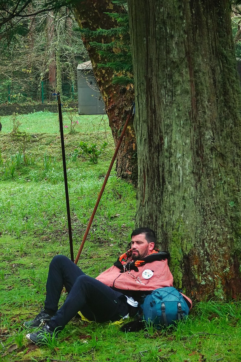  An exhausted Roman Catholic pilgrim called a Romeiro, rests against a tree during their 8-day trek around the Azorean Island of Sao Miguel, March 30, 2023 in Furnãs, Portugal. The pilgrims visit 100 shrines and churches during the event dating from 