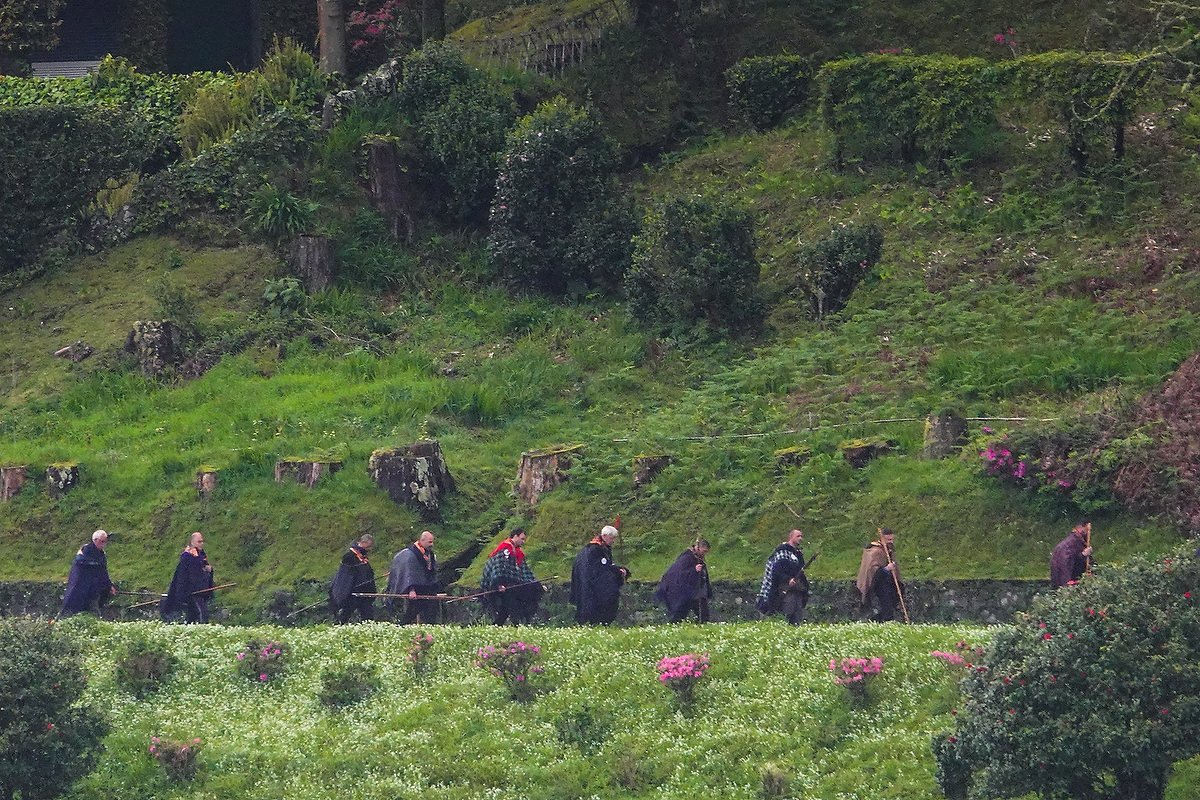  Roman Catholic pilgrims called Romeiros, walk a rural road in mist and rain during their 8-day trek around the Azorean Island of Sao Miguel, March 30, 2023 in Furnãs, Portugal. The pilgrims visit 100 shrines and churches during the event dating from