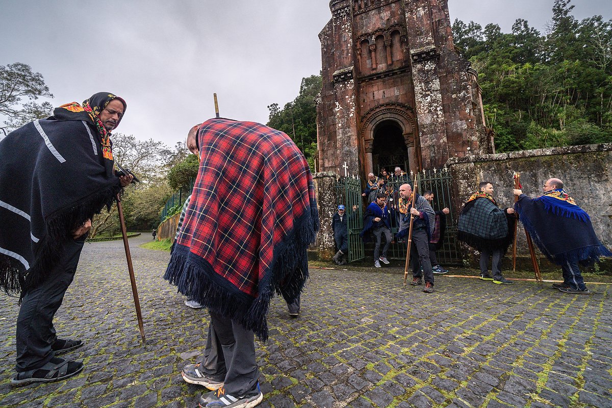  Roman Catholic pilgrims called a Romeiros, gather outside the Our Lady of Victories Chapel in mist and rain during their 8-day trek around the Azorean Island of Sao Miguel, March 30, 2023 in Furnãs, Portugal. The pilgrims visit 100 shrines and churc