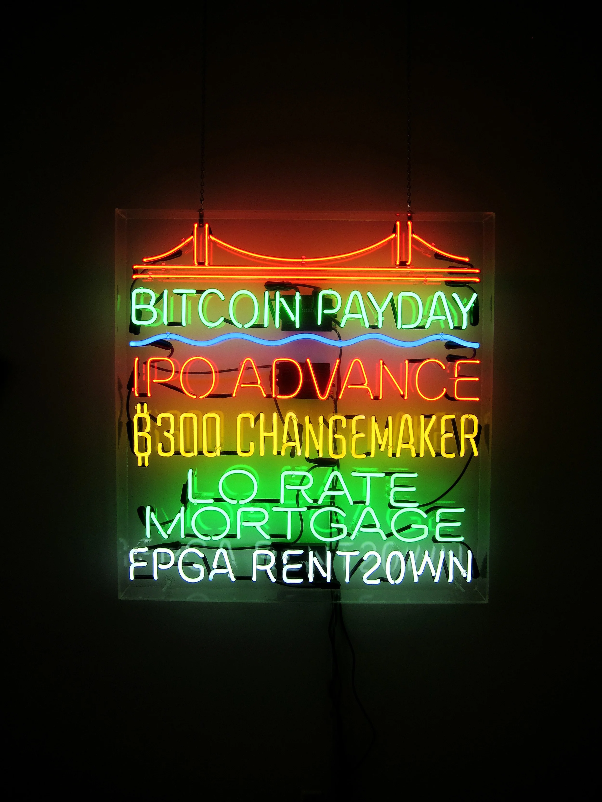 Tom Loughlin's neon signage speaks to aspects of the economy that are often ignored.