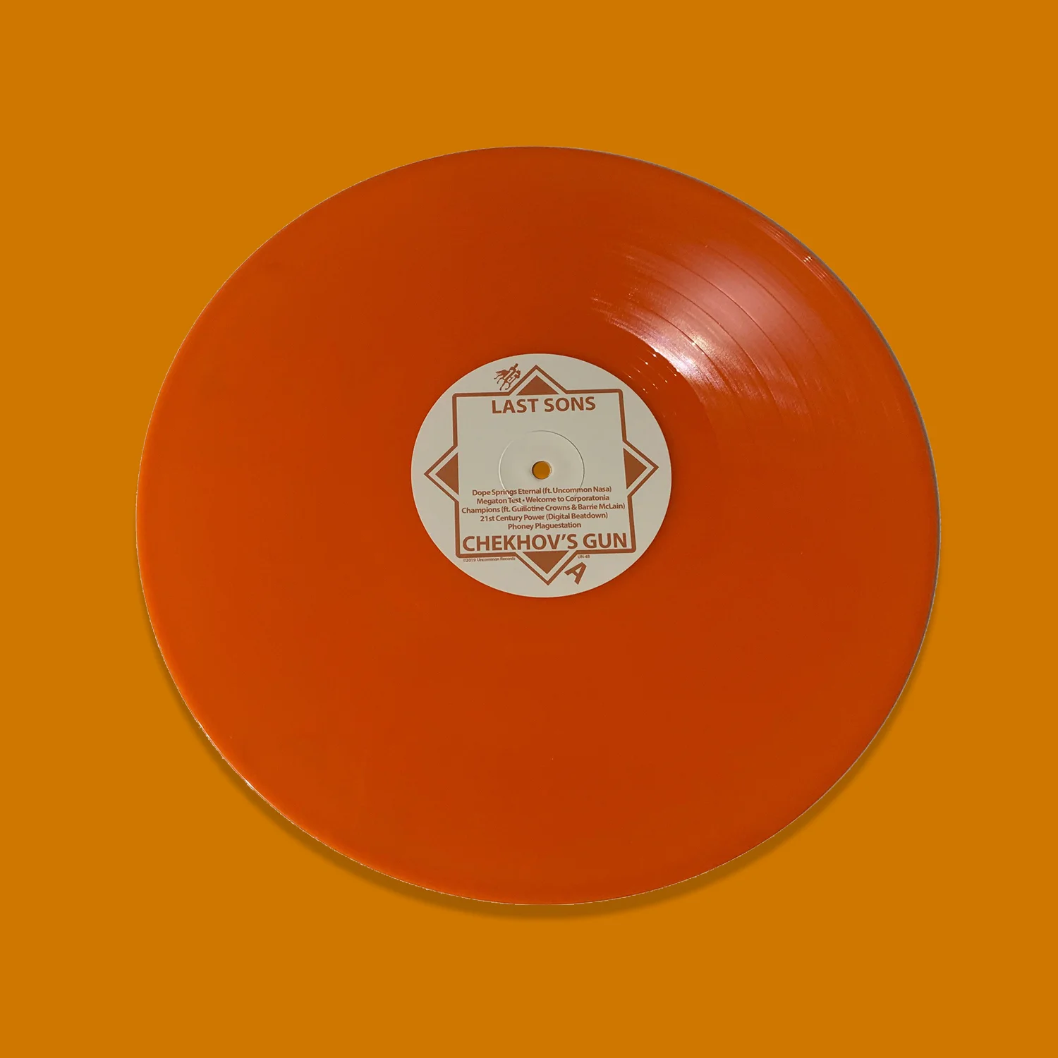 ChekhovsGunOrangeVinylButton.jpg