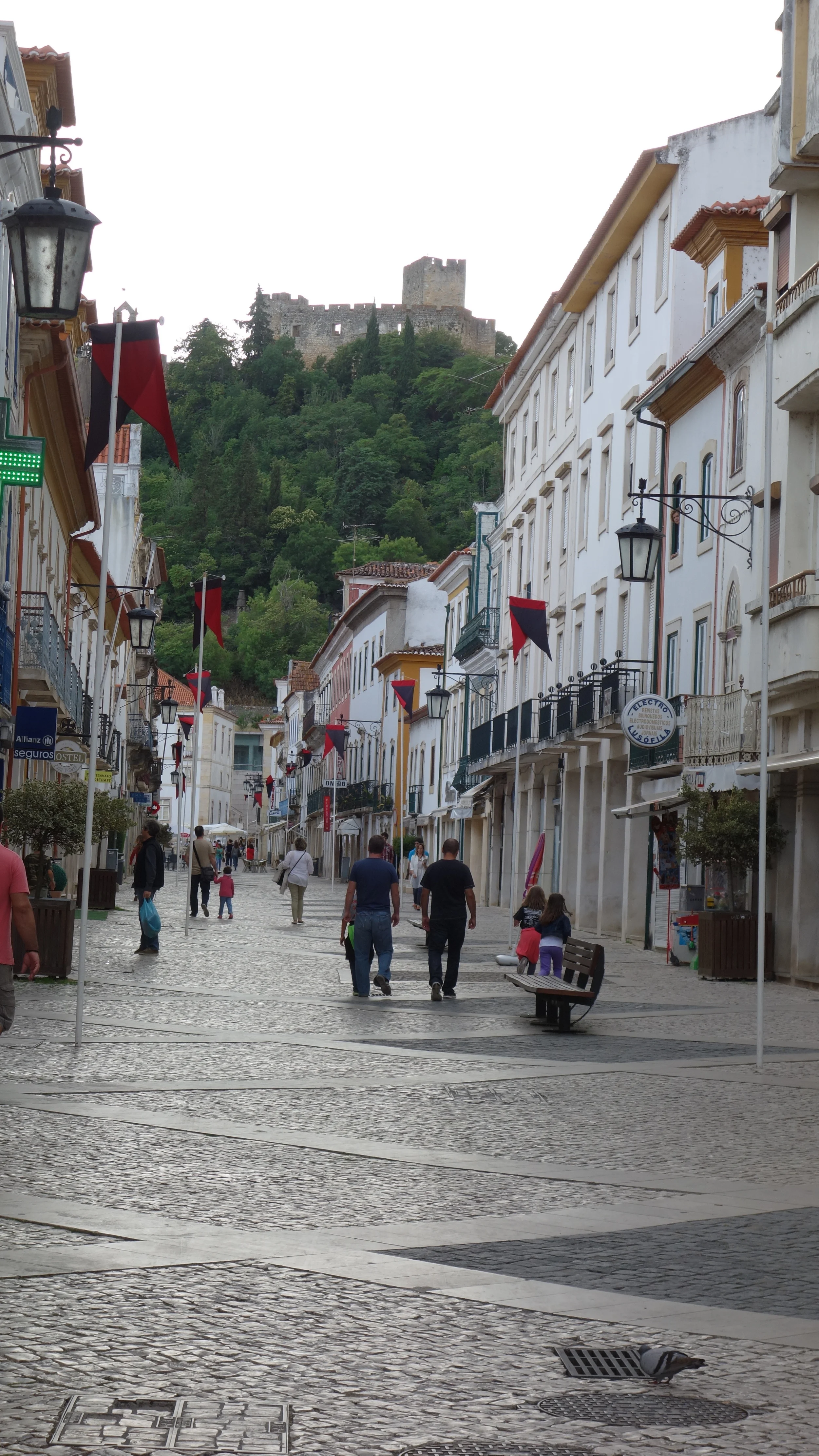 Walking in Tomar with the Convento de Cristo looking down upon us.