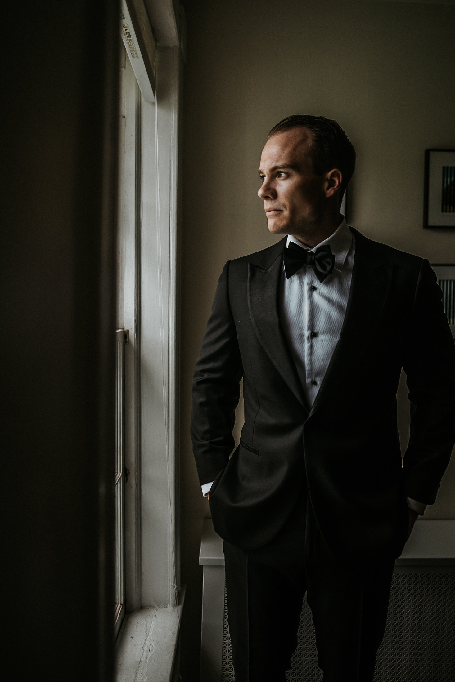 Groom+posing+in+front+of+mirror.jpeg